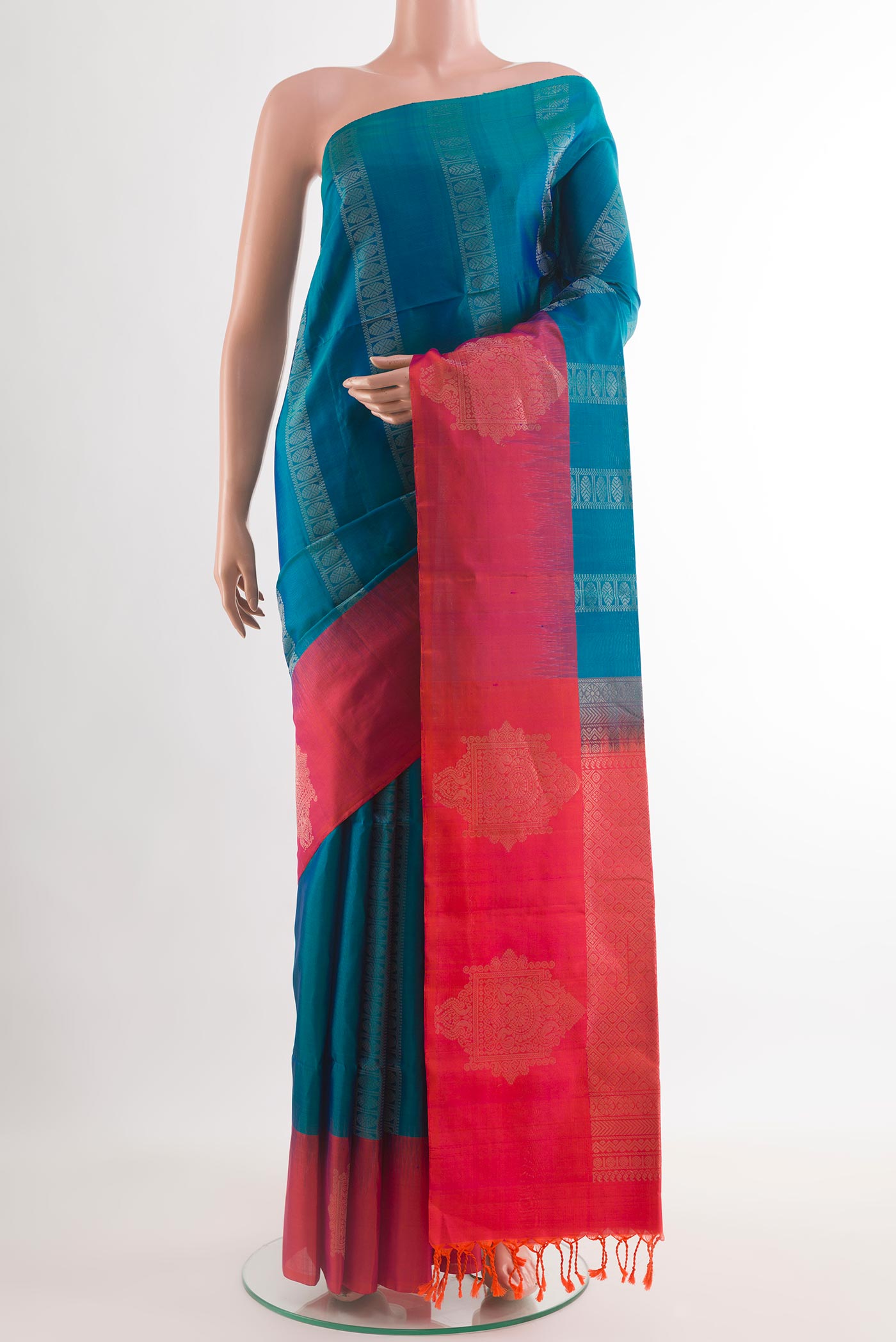 Blue Soft Silk Saree with Zari Butta on the body and Zari Border.  displayed on a mannequin