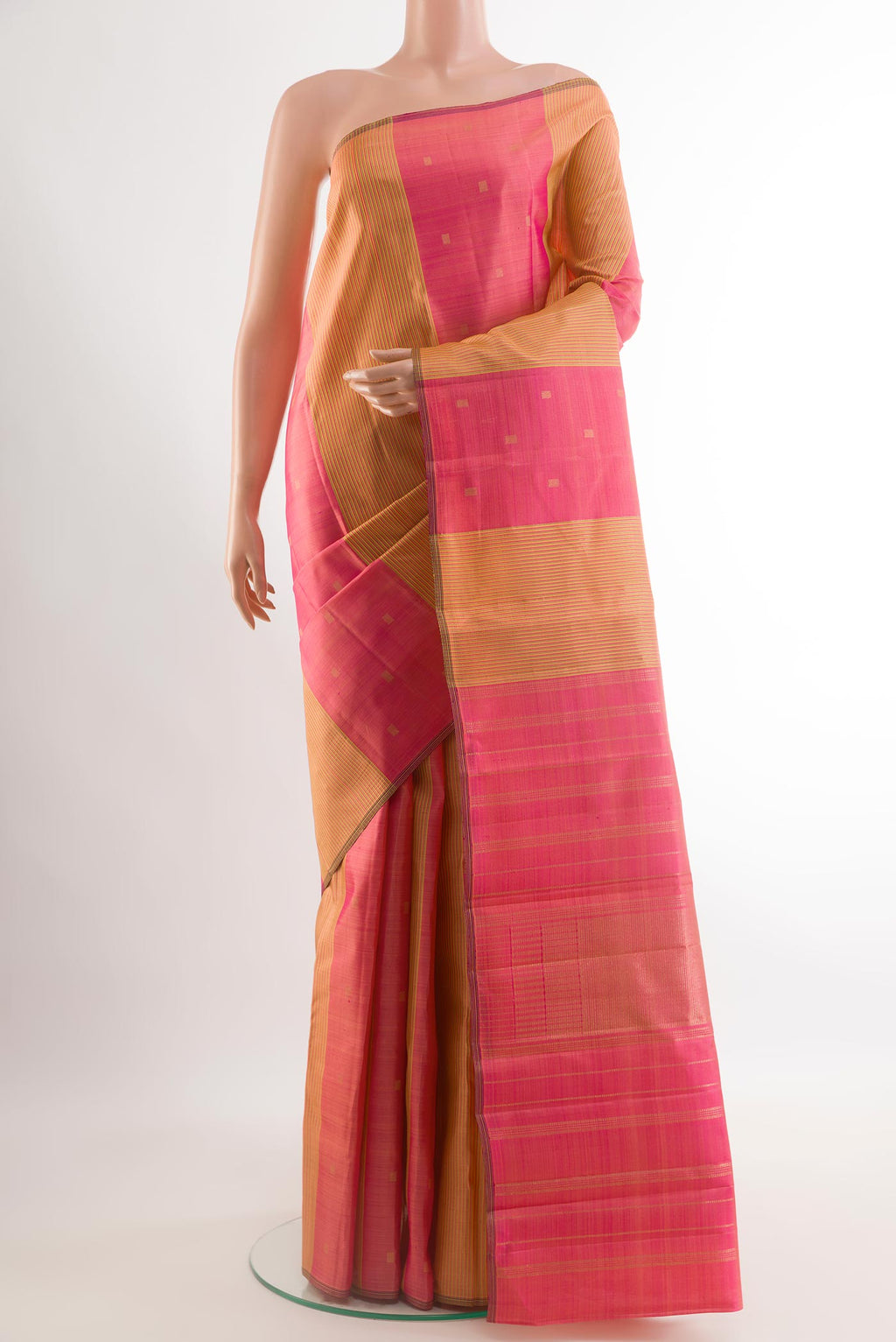 Pink Kanjivaram Silk Saree with Zari Butta on the body and Without Border.  displayed on a mannequin