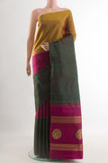 Pure Silk Pure Zari Multi Color Kanchipuram Saree with Zari Butta on the body and Ganga Jamuna Border.  displayed on a mannequin