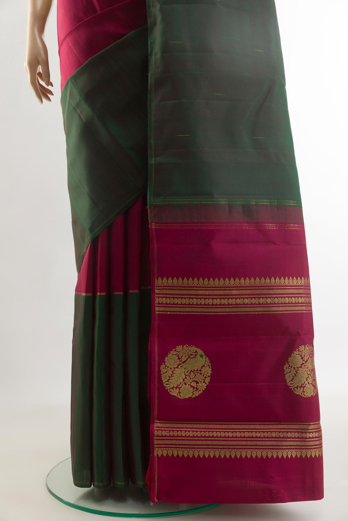Pleats and pallu of Pure Silk Pure Zari Multi Color Kanchipuram Saree with Zari Butta on the body and Ganga Jamuna Border. 