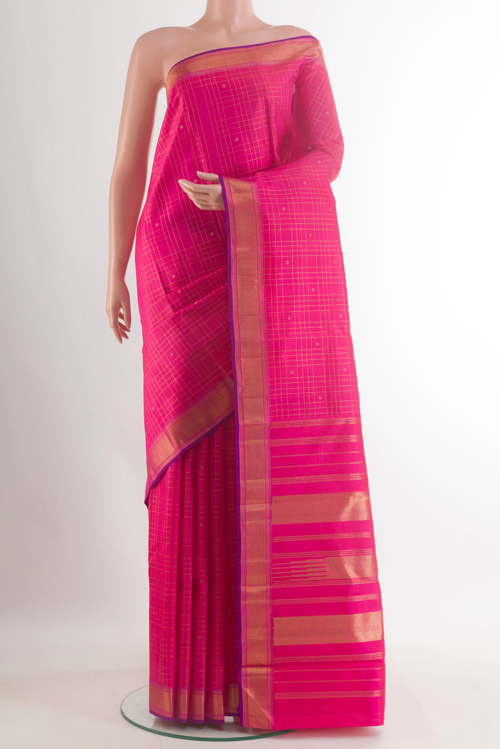 Pure Silk Pink Kanchipuram Saree with Checked design on the body and Zari Border.  displayed on a mannequin