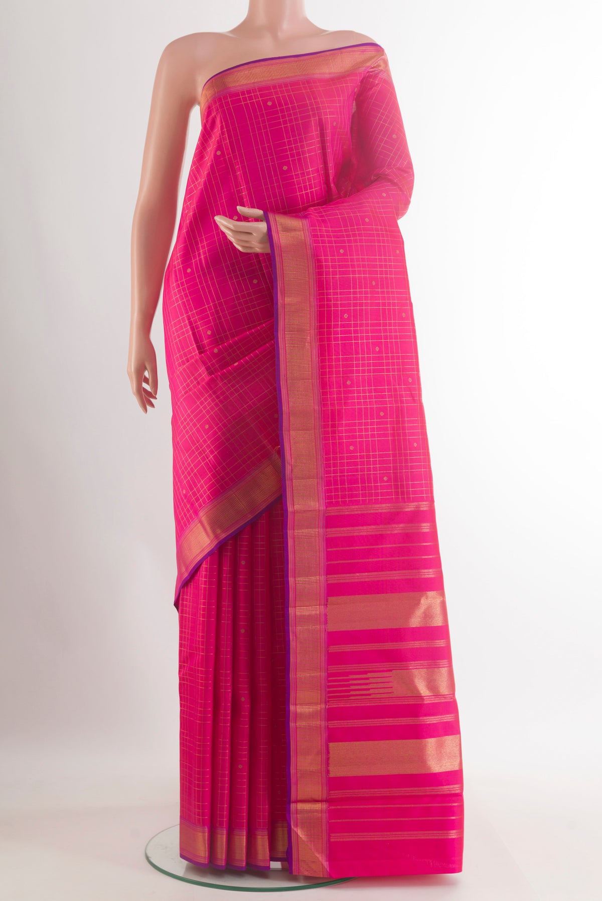 Pure Silk Pink Kanchipuram Saree with Checked design on the body and Zari Border.  displayed on a mannequin