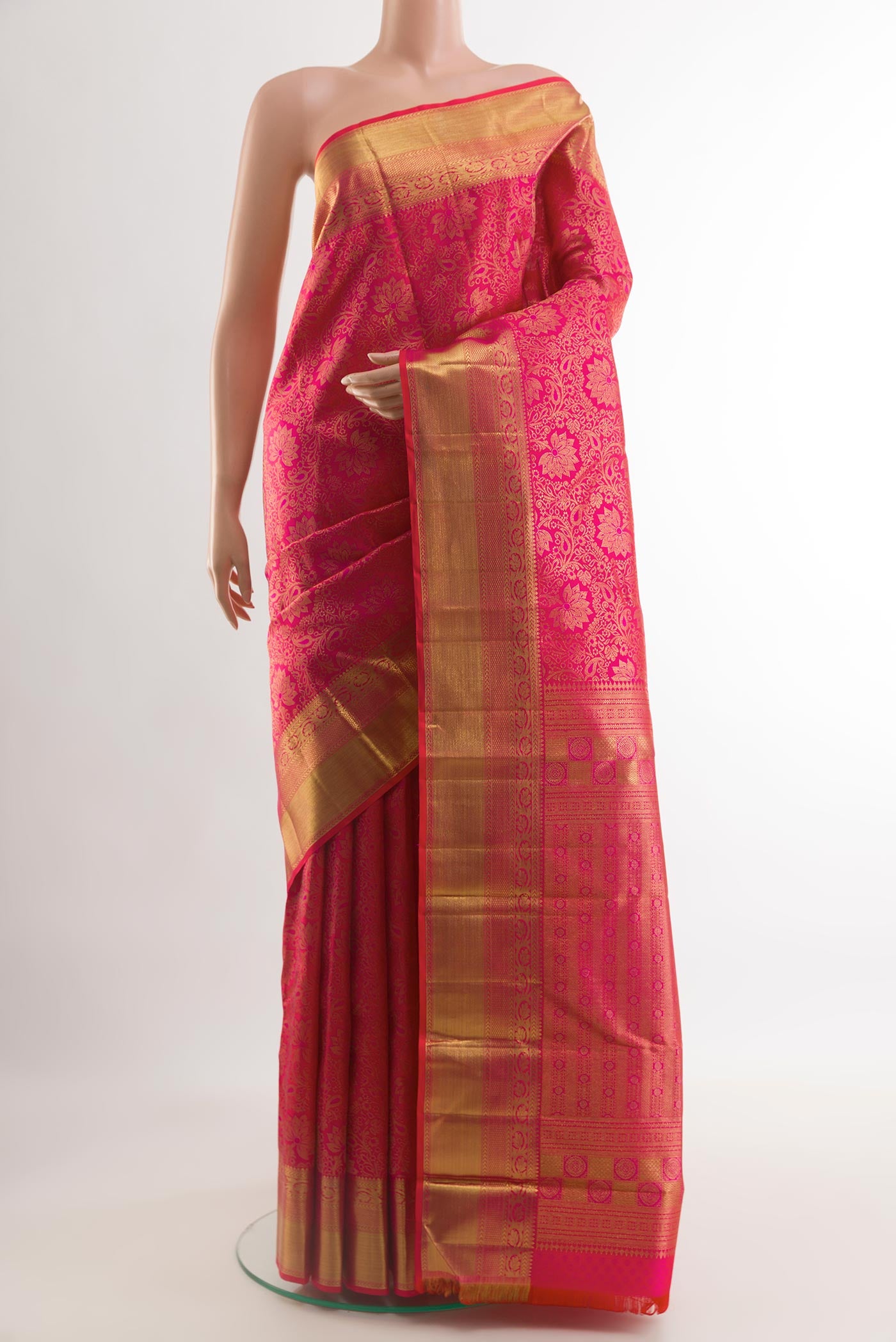 Pink Kanchipuram Silk Saree with Zari Brocade on the body and Zari Border.  displayed on a mannequin