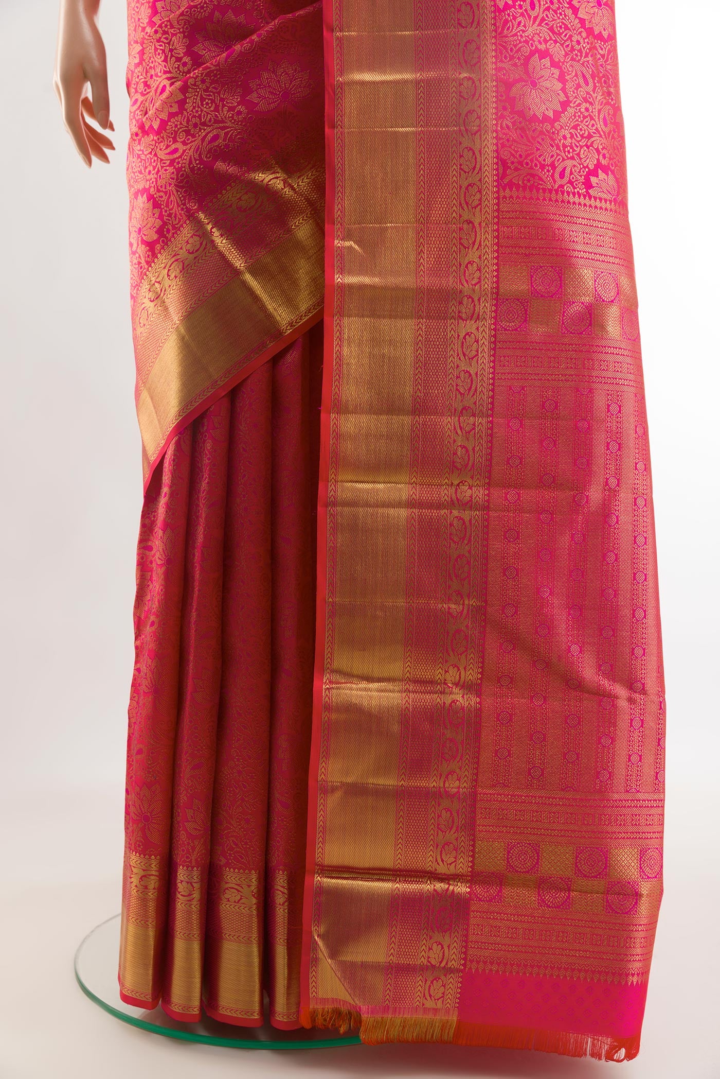 Pleats and pallu of Pink Kanchipuram Silk Saree with Zari Brocade on the body and Zari Border. 