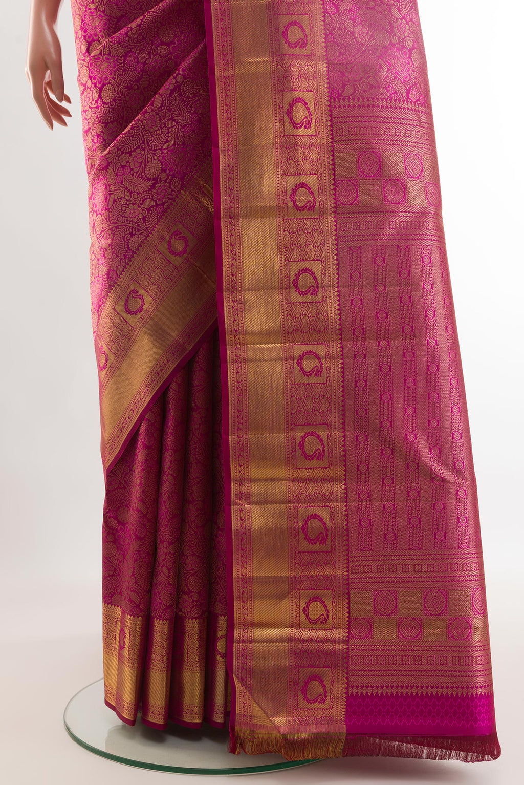 Pleats and pallu of Magenta Kanchipuram Silk Saree with Zari Brocade on the body and Zari Border. 