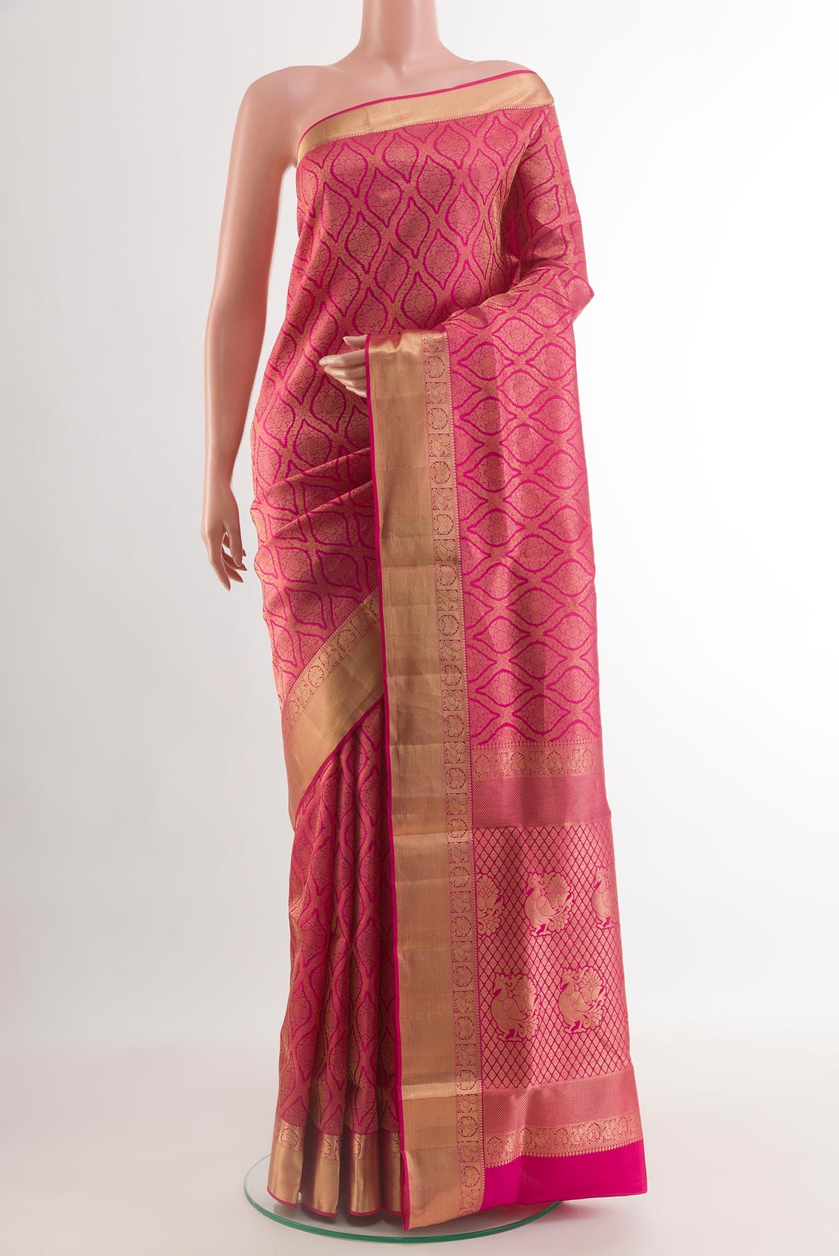 Pink Soft Silk Saree with Zari Brocade on the body and Zari Border.  displayed on a mannequin