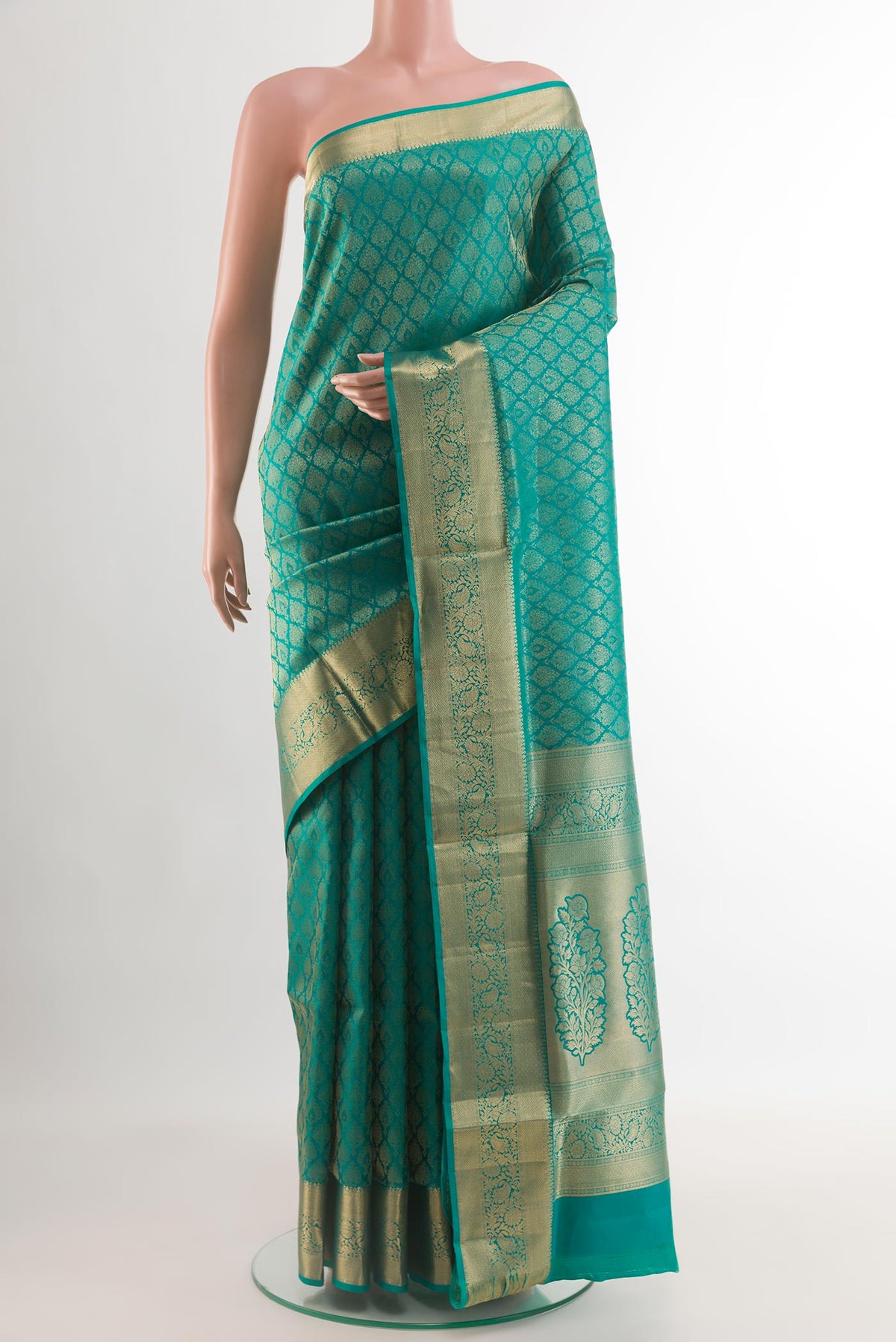 Sea Green Soft Silk Saree with Zari Brocade on the body and Zari Border.  displayed on a mannequin