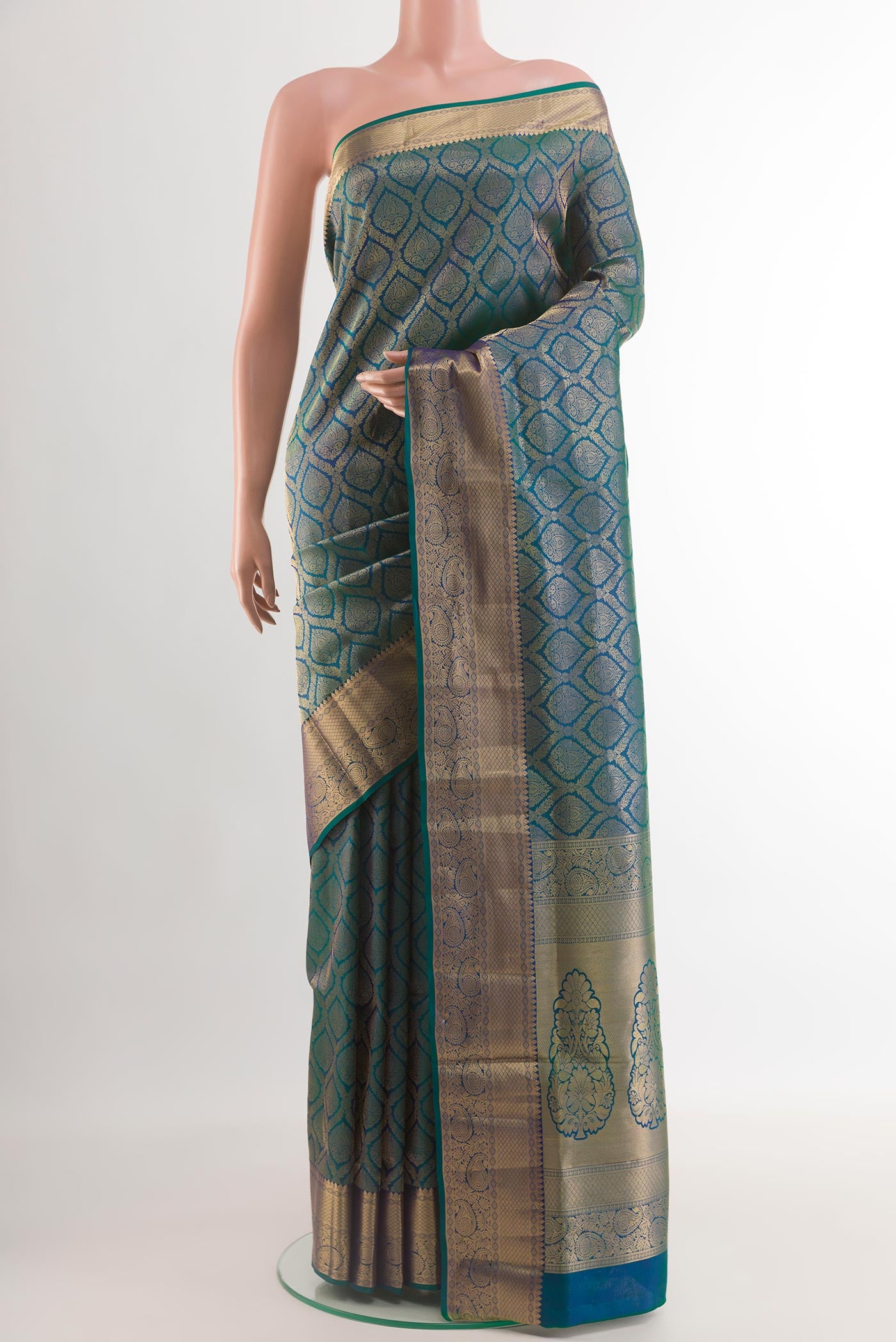 Peacock Blue Soft Silk Saree with Zari Brocade on the body and Zari Border.  displayed on a mannequin