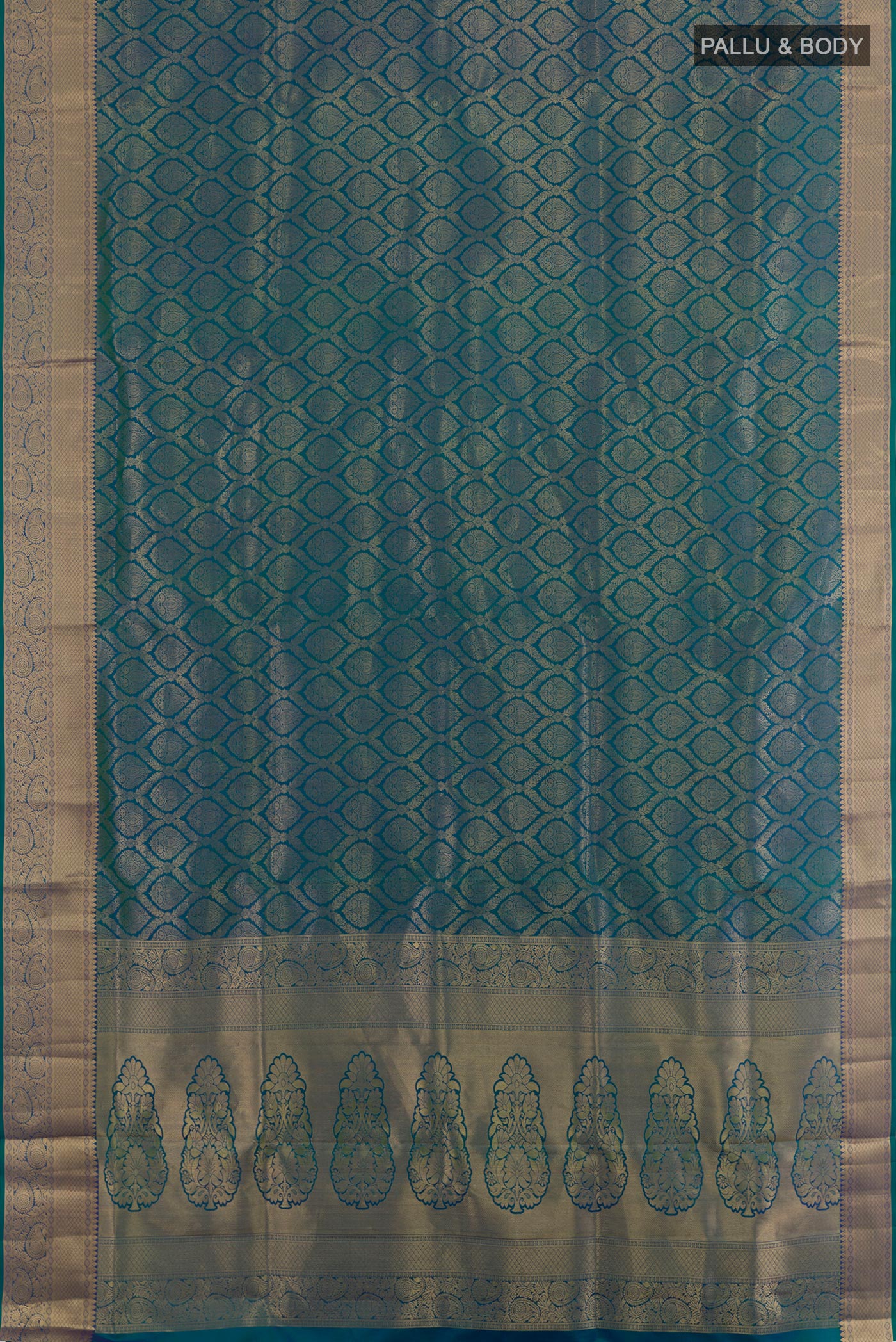 Flat view of Peacock Blue Soft Silk Saree with Zari Brocade on the body and Zari Border. 
