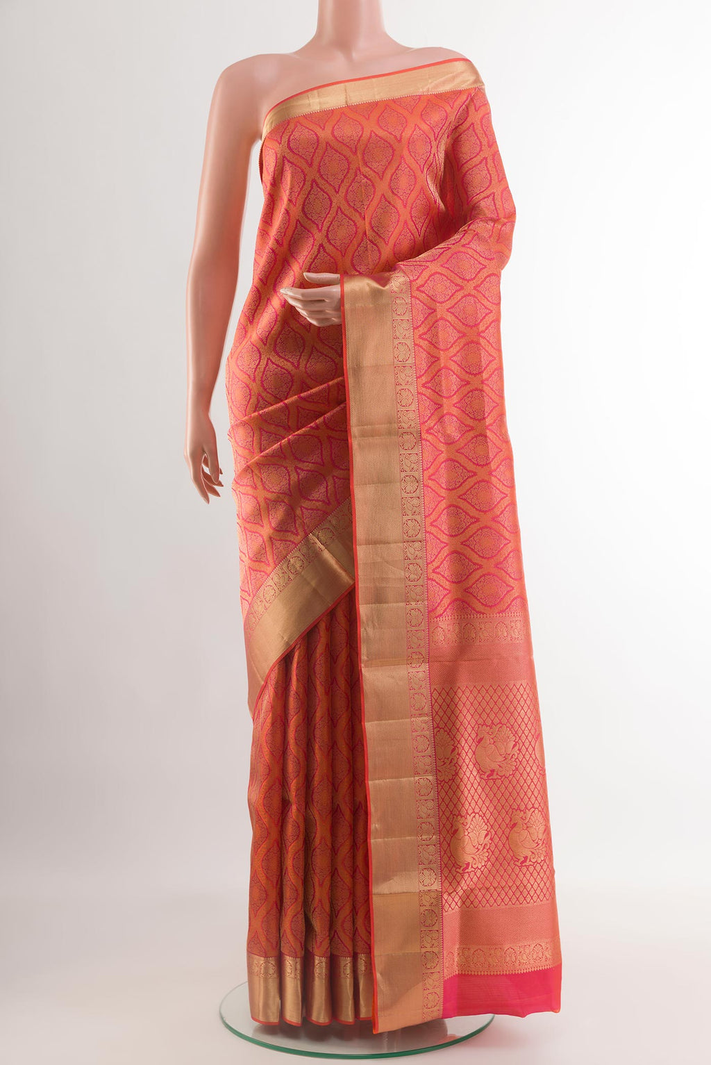 Orange with Pink Color Soft Silk Saree with Zari Brocade on the body and Zari Border.  displayed on a mannequin