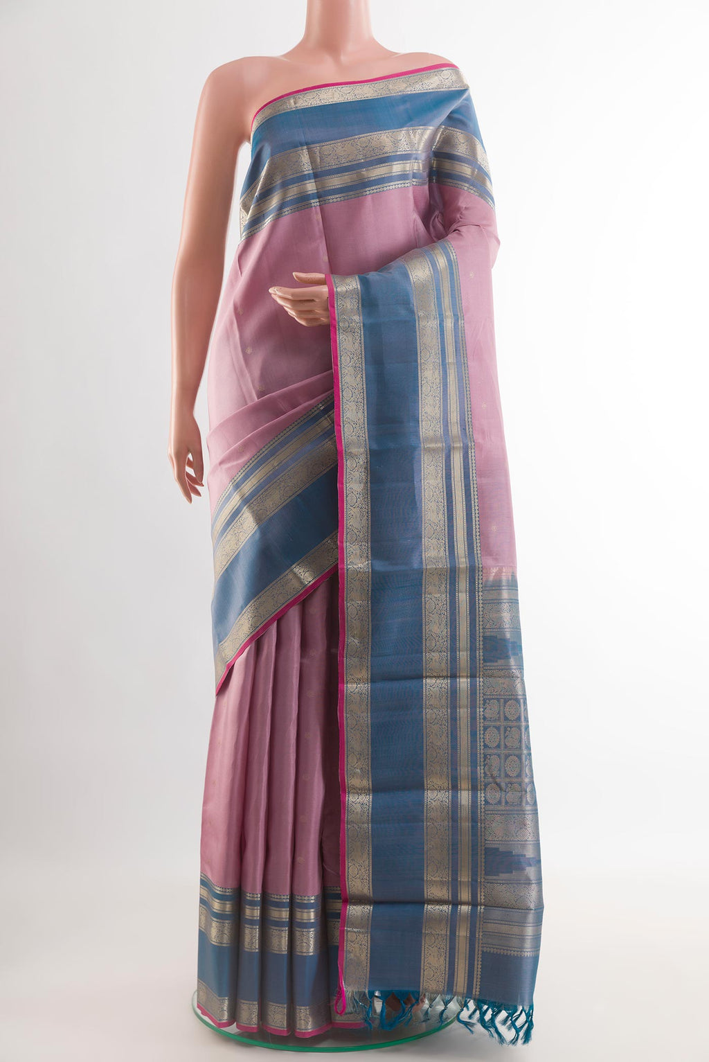 Lavender Kanchipuram Silk Saree with Zari Butta on the body and Zari Border.  displayed on a mannequin