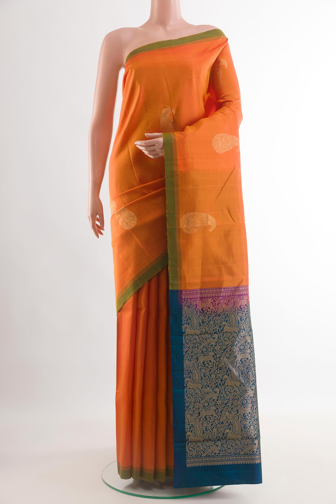 Orange Kanchipuram Silk Saree with Zari Butta on the body and Plain Border.  displayed on a mannequin