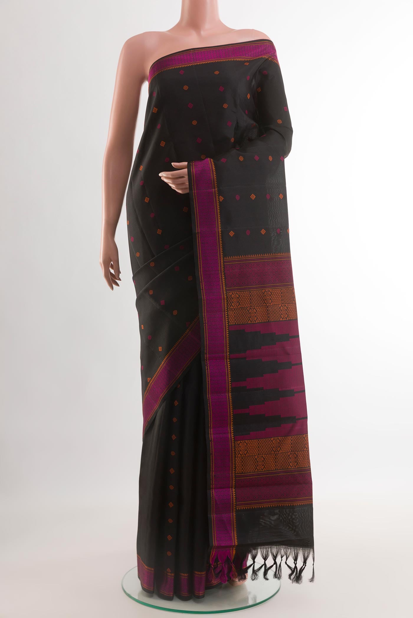 Black Kanchipuram Silk Saree with Thread Butta on the body and Thread Border.  displayed on a mannequin