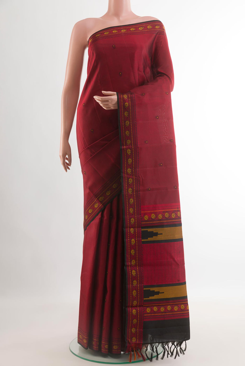 Red Kanchipuram Silk Saree with Thread Butta on the body and Zari Border.  displayed on a mannequin