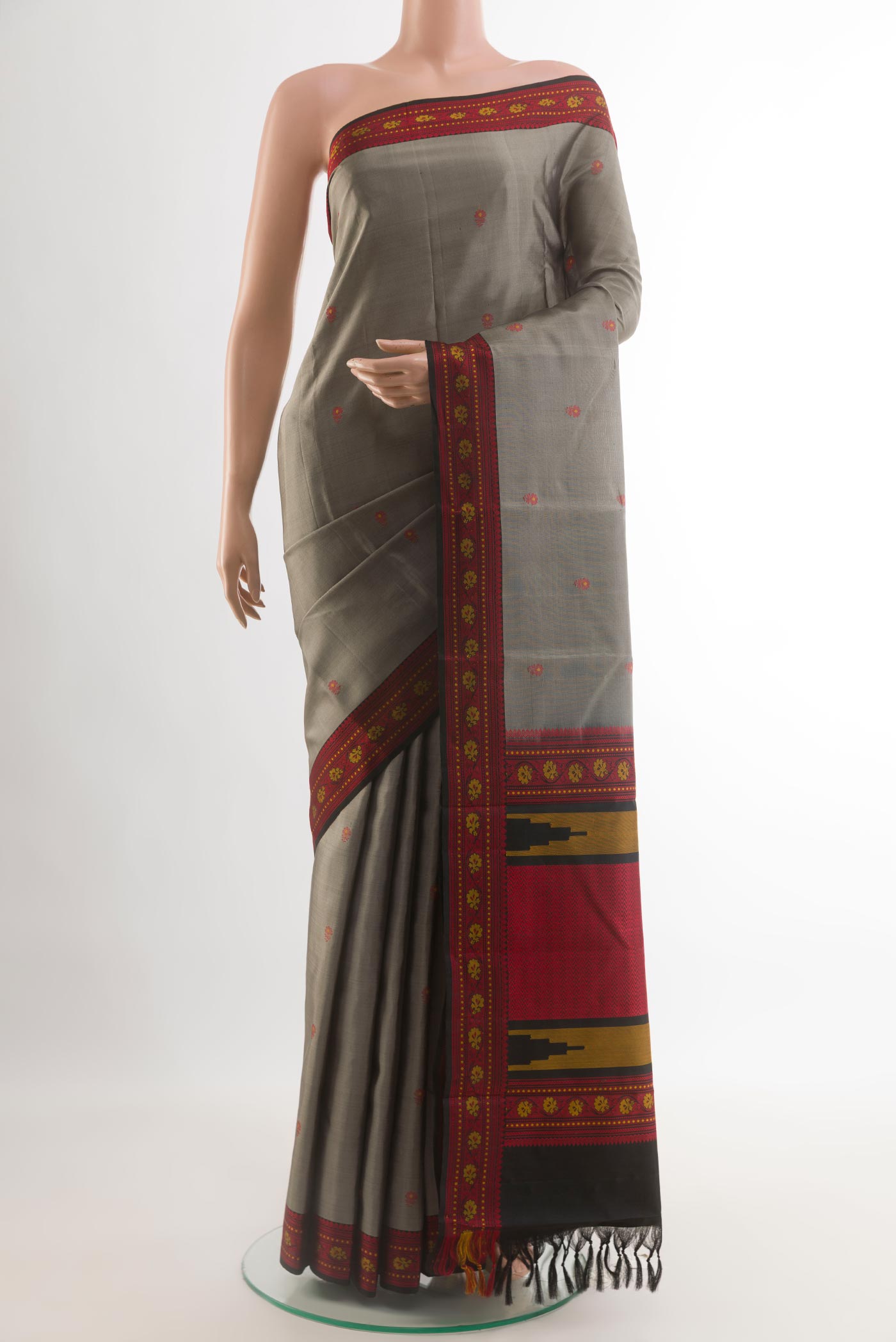 Grey Kanchipuram Silk Saree with Thread Butta on the body and Thread Border.  displayed on a mannequin