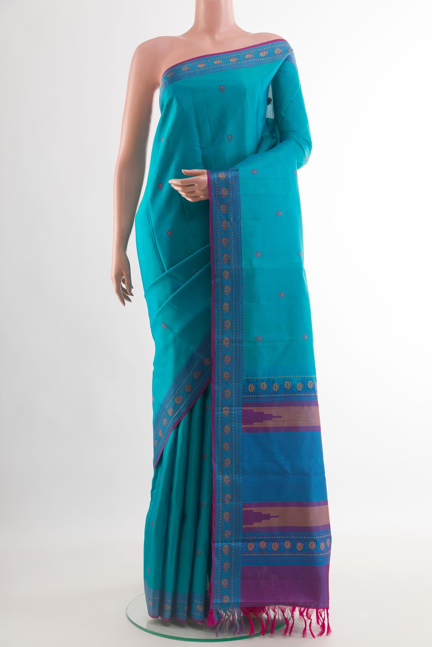 Blue Kanchipuram Silk Saree with Thread Butta on the body and Thread Border.  displayed on a mannequin