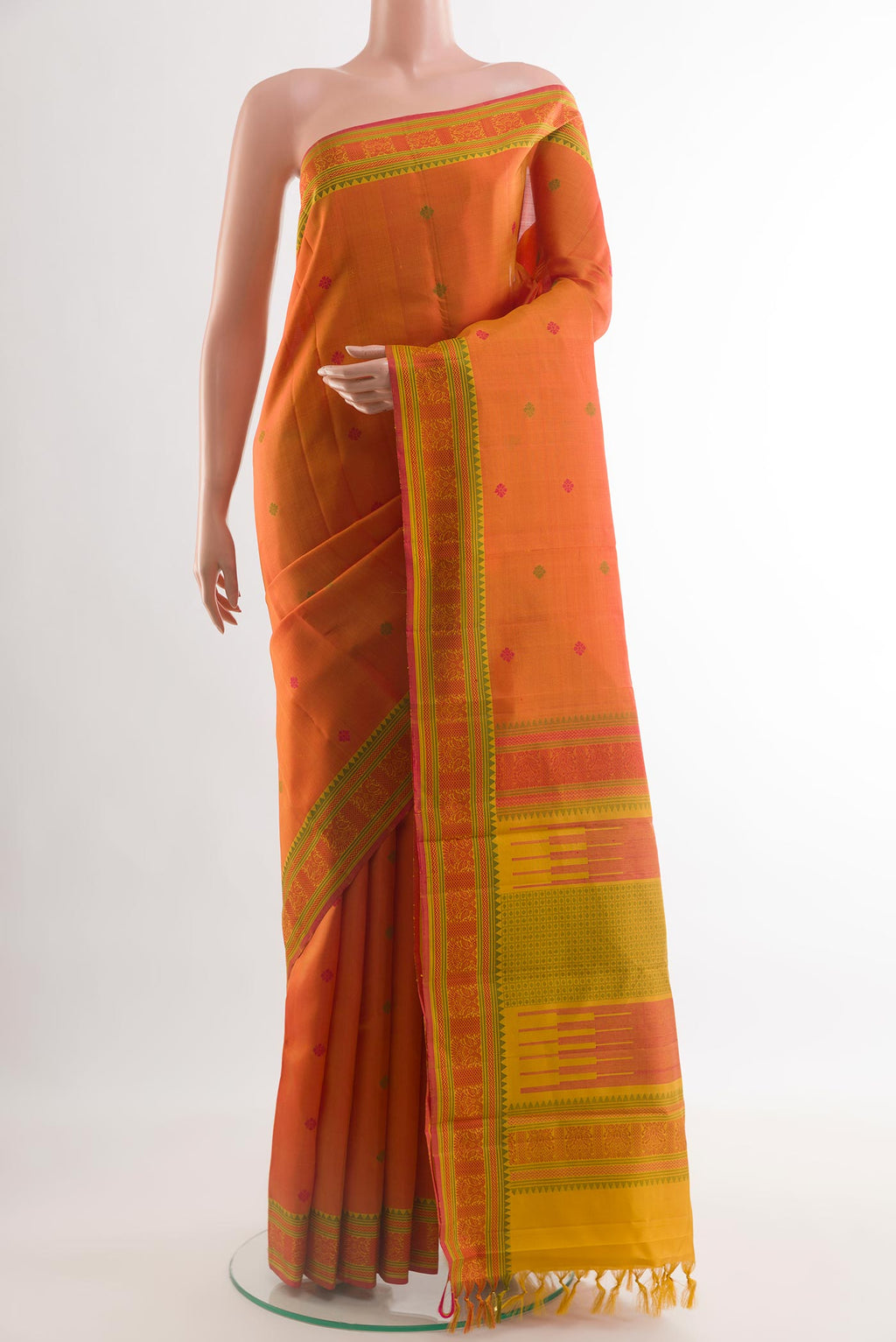 Orange Kanchipuram Silk Saree with Thread Butta on the body and Thread Border.  displayed on a mannequin