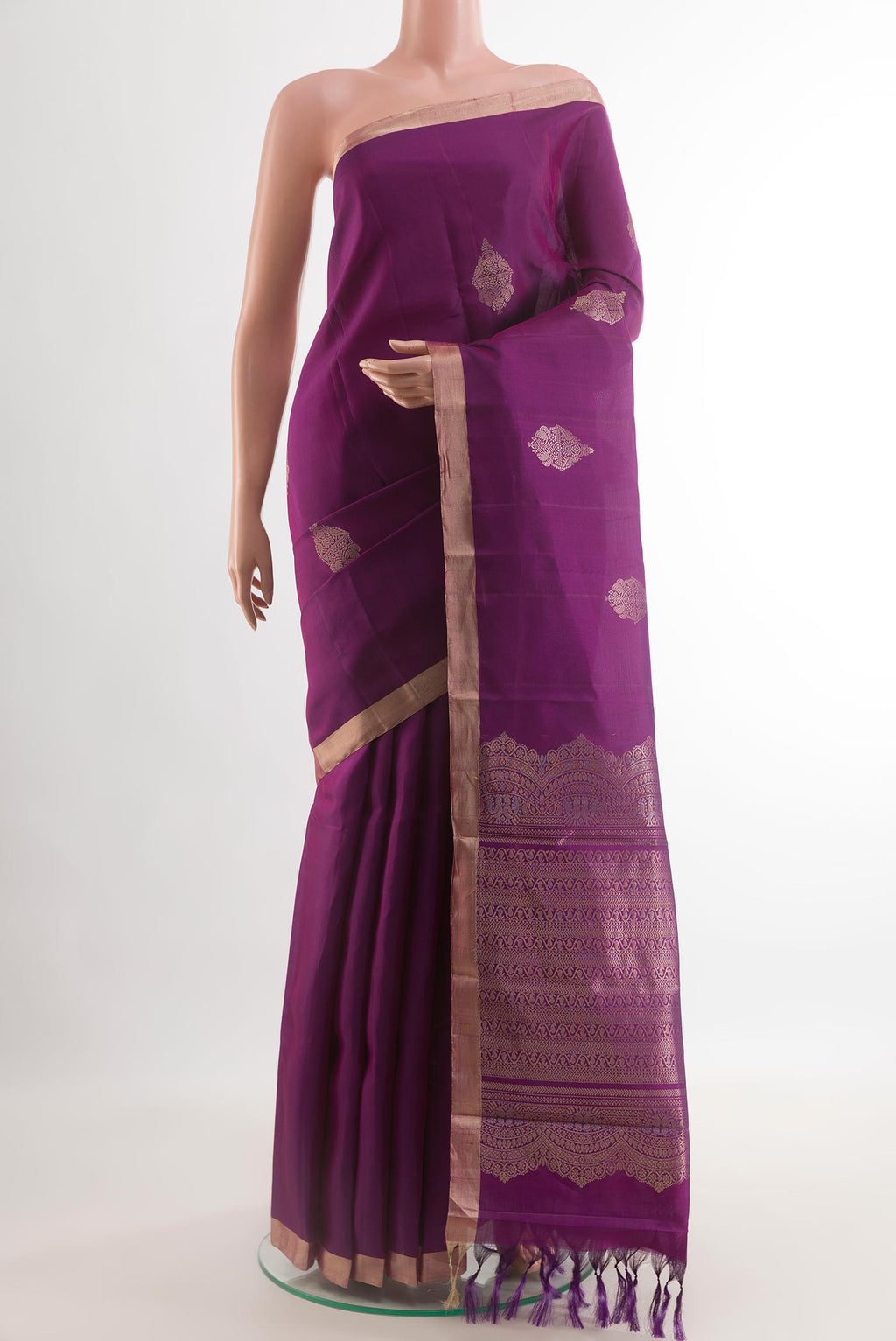 Purple Kanjivaram Silk Saree with Zari Butta on the body and Zari Border.  displayed on a mannequin