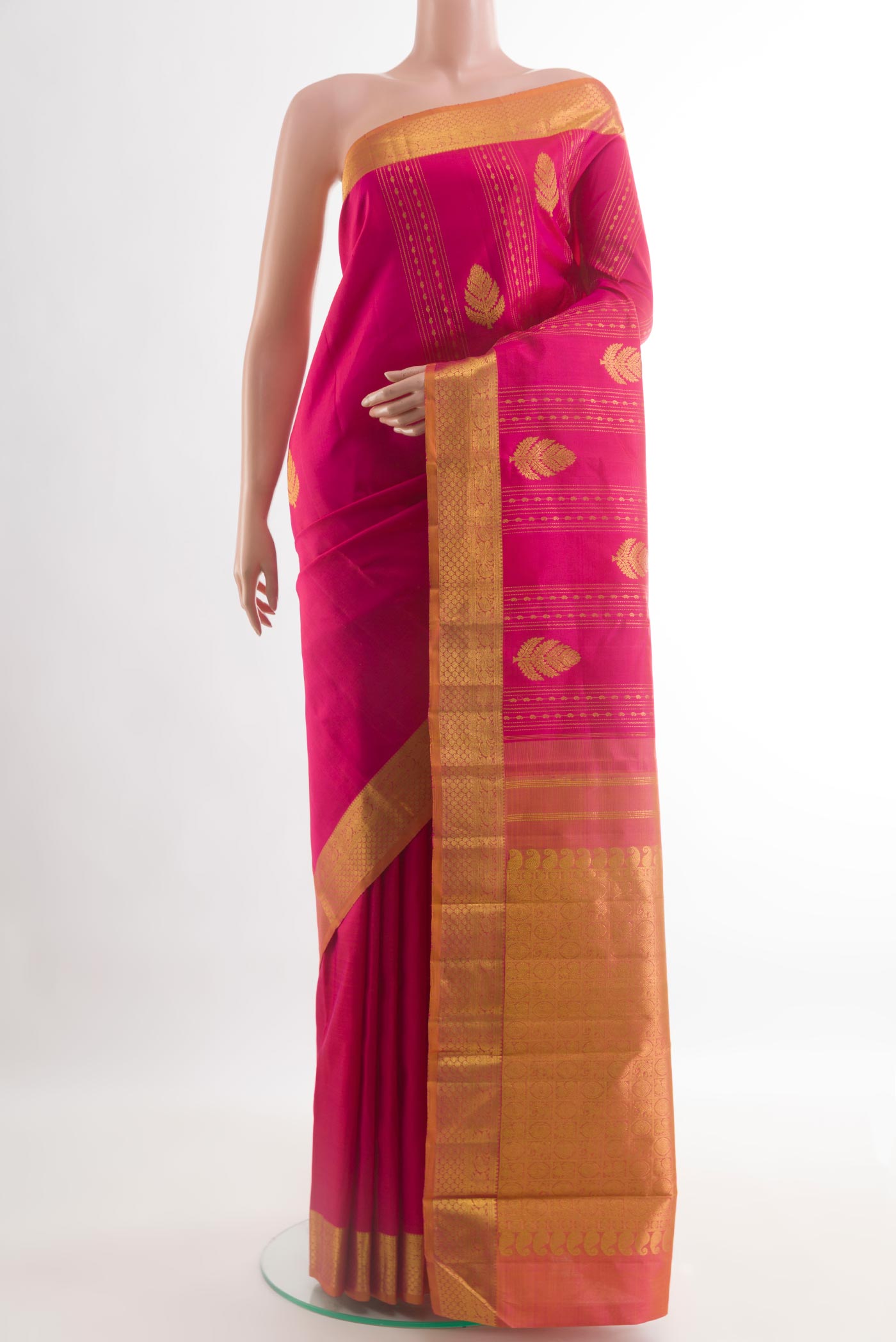 Pink Kanjivaram Silk Saree with Zari Butta on the body and Zari Border.  displayed on a mannequin