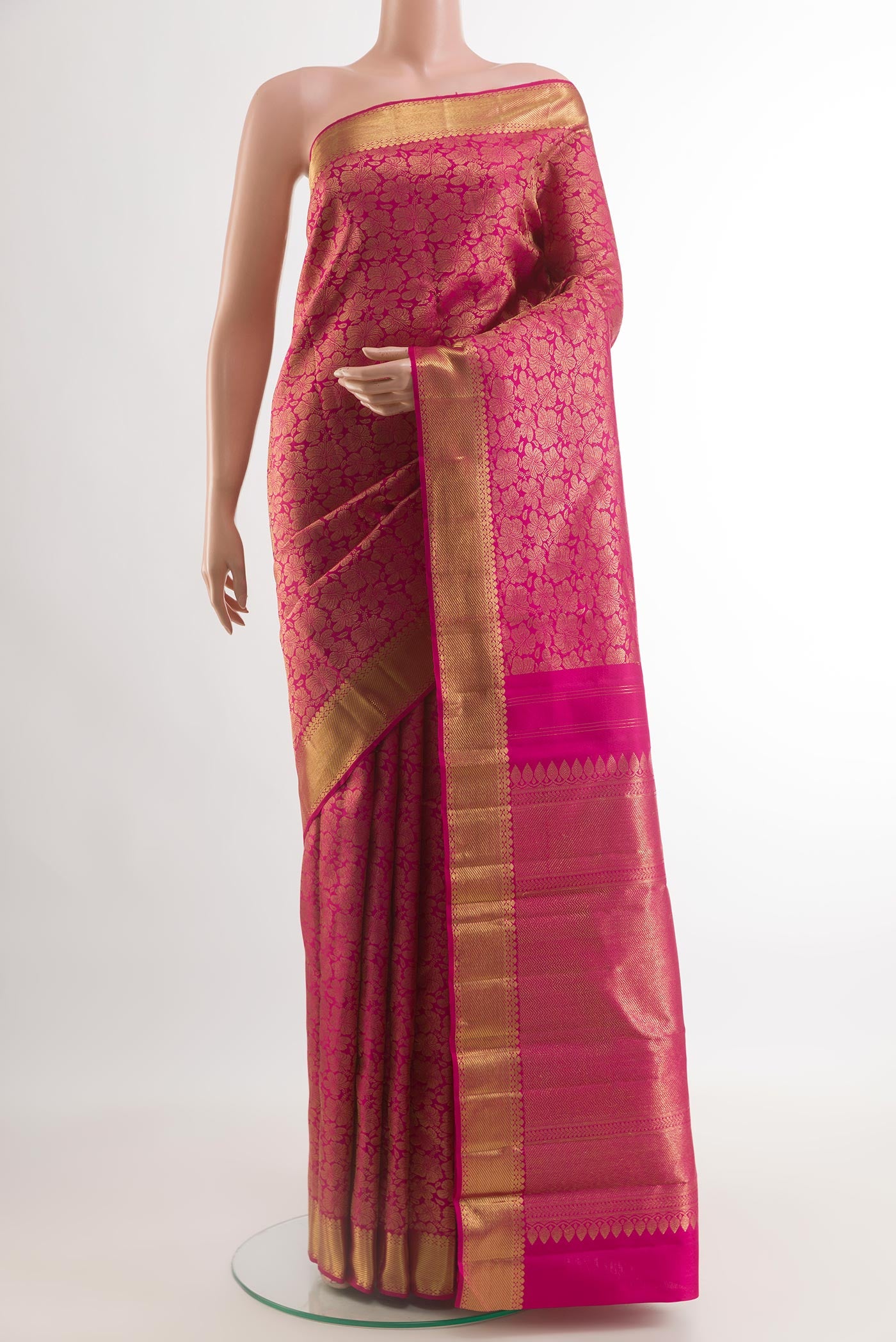 Pure Silk Pure Zari Pink Kanjivaram Saree with Zari Brocade on the body and Zari Border.  displayed on a mannequin