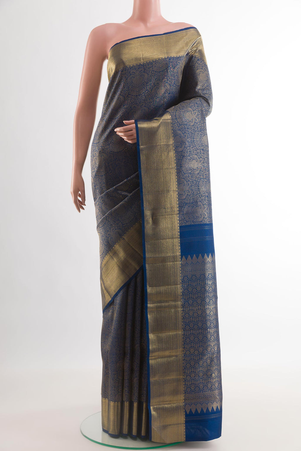 Pure Silk Pure Zari Blue Kanjivaram Saree with Zari Brocade on the body and Zari Border.  displayed on a mannequin
