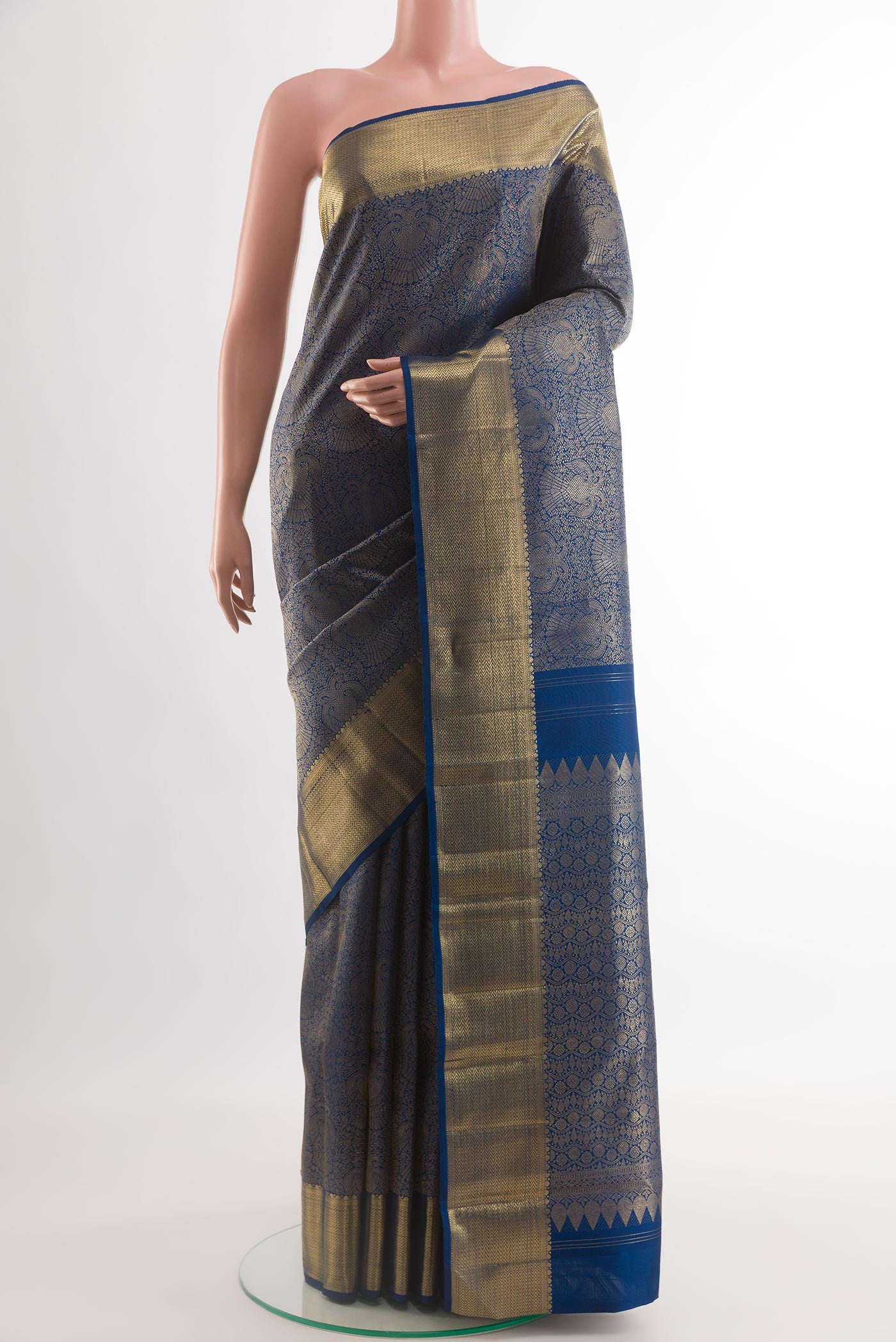 Pure Silk Pure Zari Blue Kanjivaram Saree with Zari Brocade on the body and Zari Border.  displayed on a mannequin
