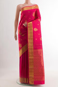 Pink Kanjivaram Silk Saree with Zari Butta on the body and Zari Border.  displayed on a mannequin