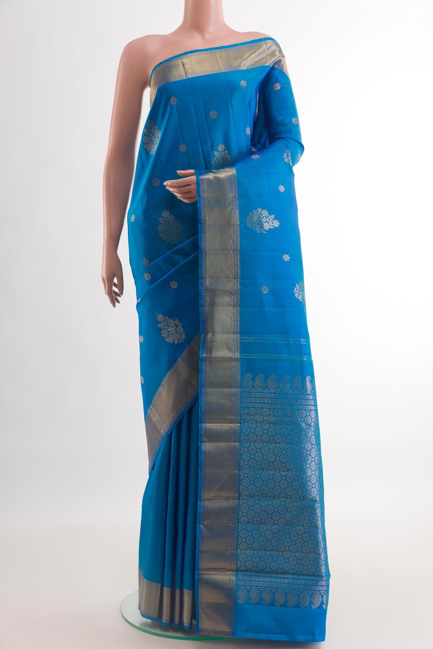 Royal Blue Kanjivaram Silk Saree with Zari Butta on the body and Zari Border.  displayed on a mannequin