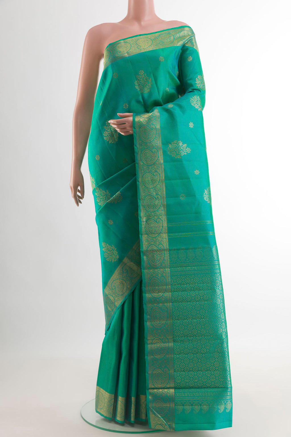 Turquoise Kanjivaram Silk Saree with Zari Butta on the body and Zari Border.  displayed on a mannequin