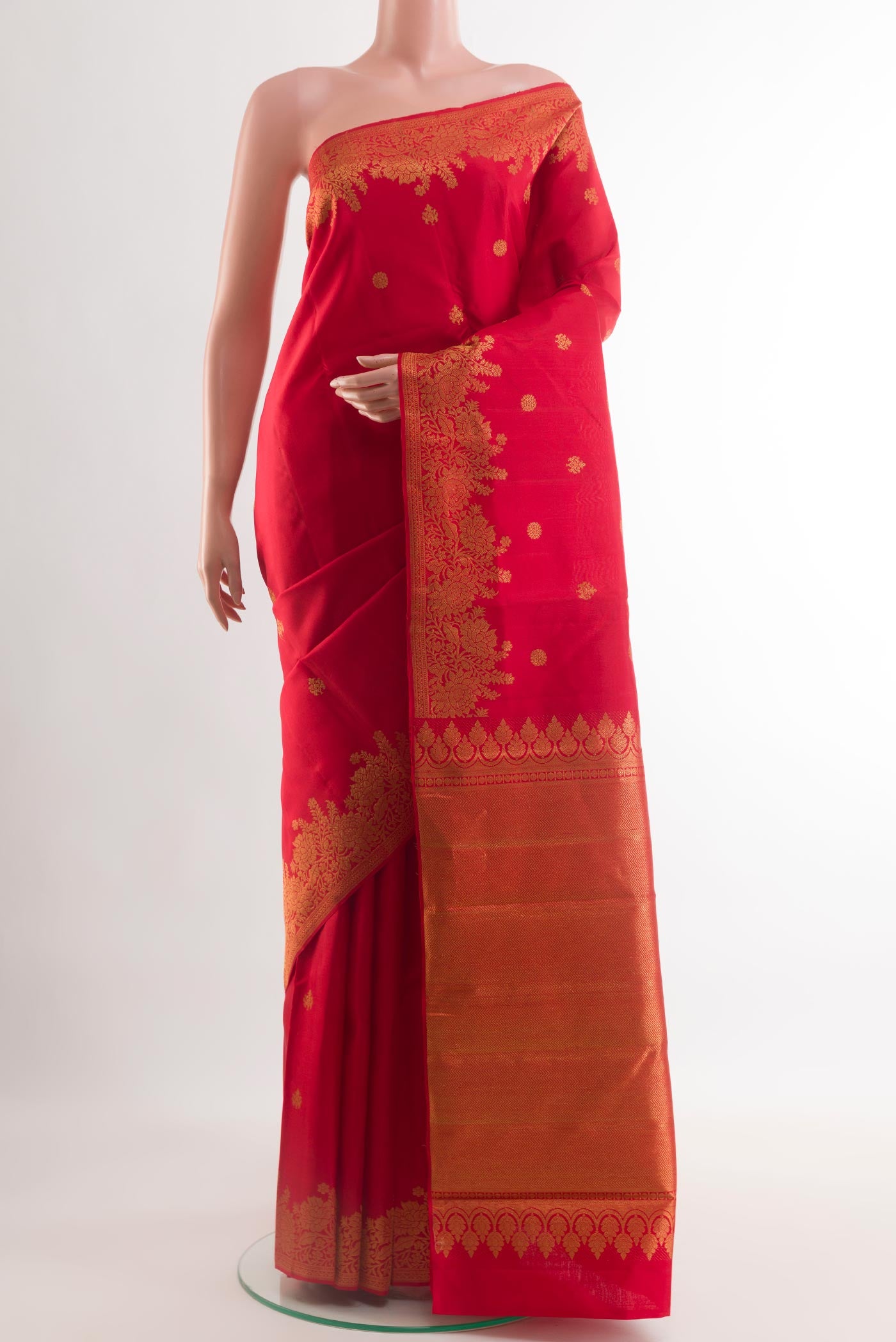 Red Kanjivaram Silk Saree with Zari Butta on the body and Zari Border.  displayed on a mannequin