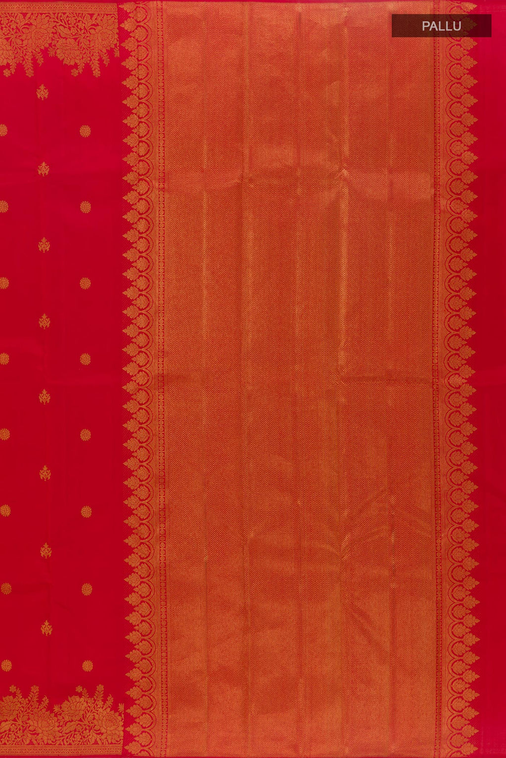 Close up image of the pallu of Red Kanjivaram Silk Saree with Zari Butta on the body and Zari Border. 