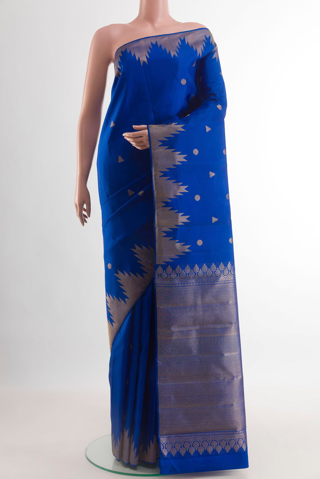 Royal Blue Kanjivaram Silk Saree with Zari Butta on the body and Temple Border.  displayed on a mannequin