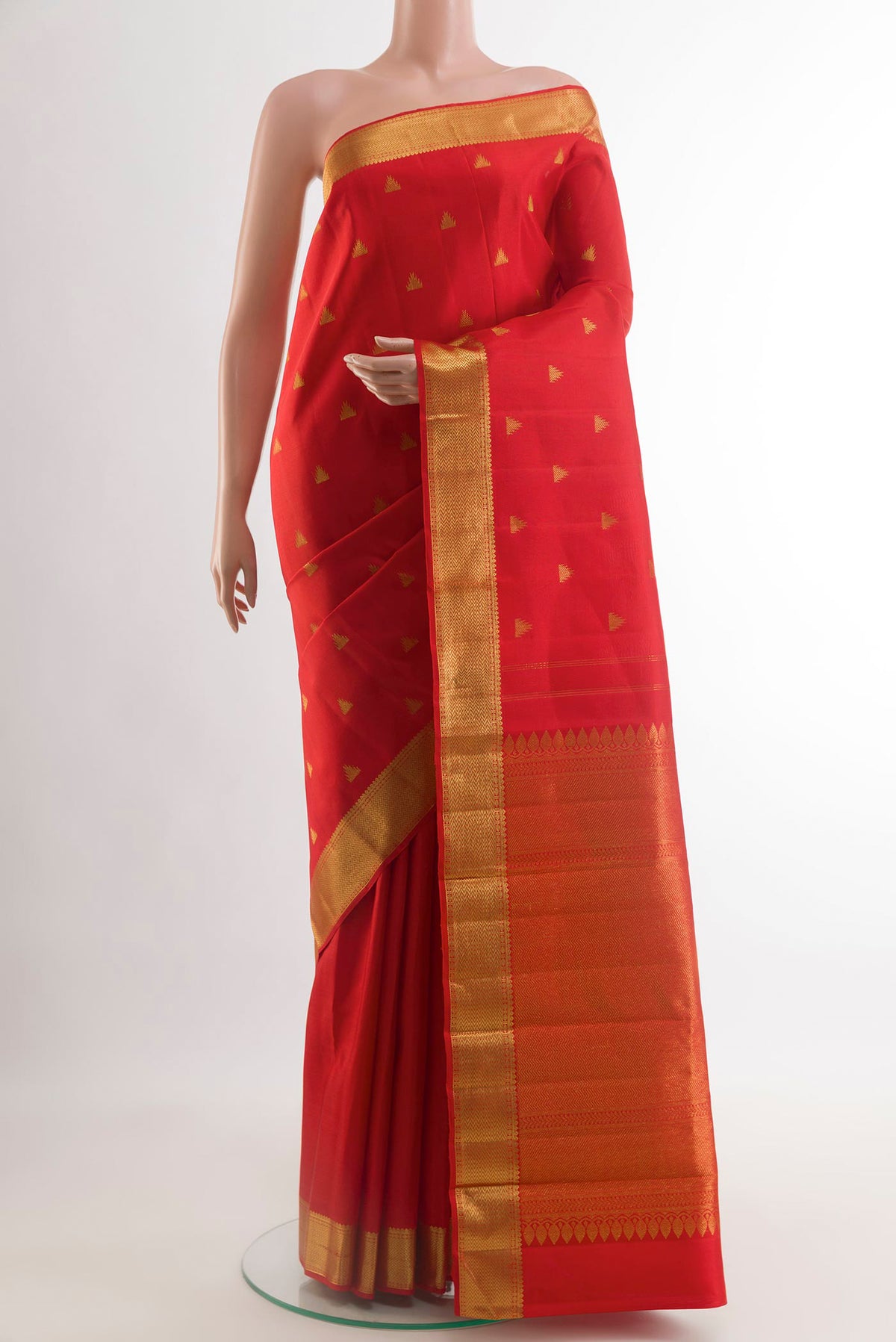 Red Kanjivaram Silk Saree with Zari Butta on the body and Zari Border.  displayed on a mannequin