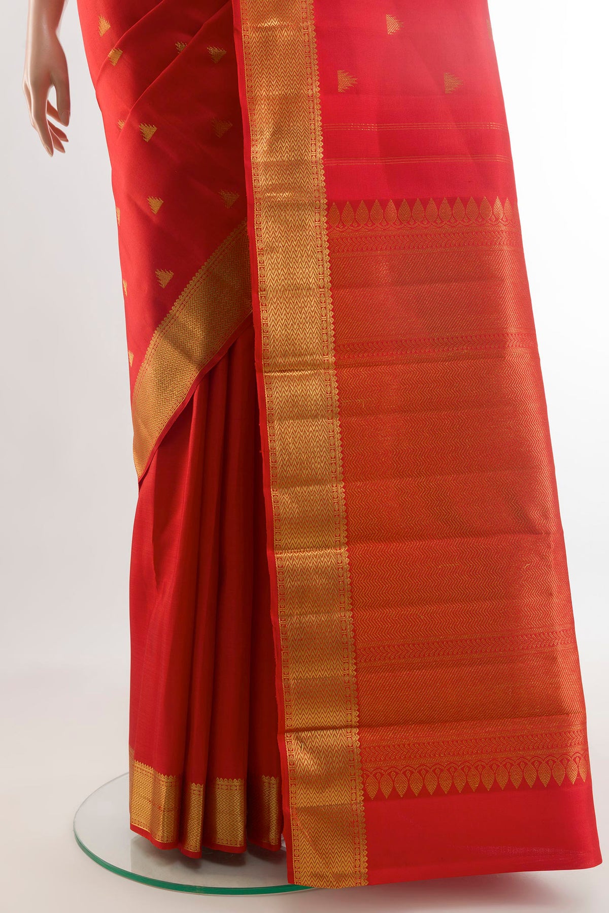 Pleats and pallu of Red Kanjivaram Silk Saree with Zari Butta on the body and Zari Border. 