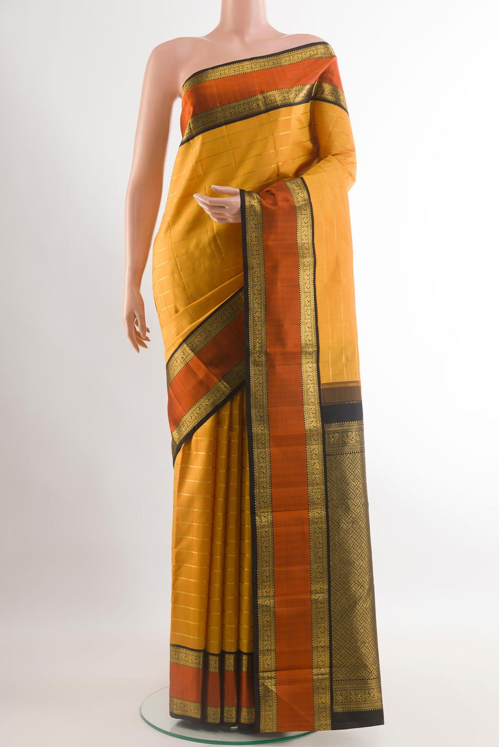 Yellow Kanjivaram Silk Saree with Stripes on the body and Zari Border.  displayed on a mannequin