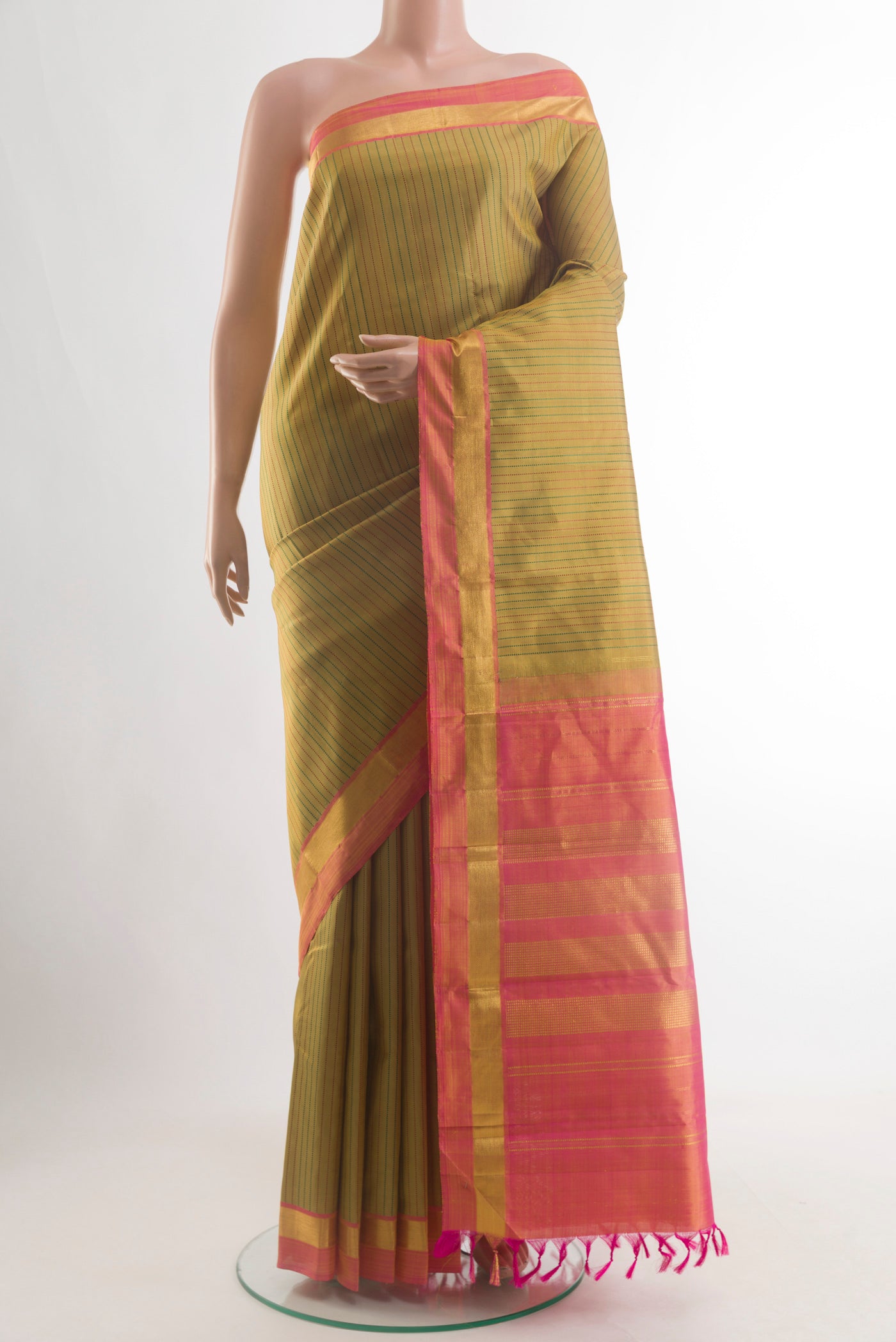 Mustard Kanchipuram Silk Saree with Stripes on the body and Zari Border.  displayed on a mannequin
