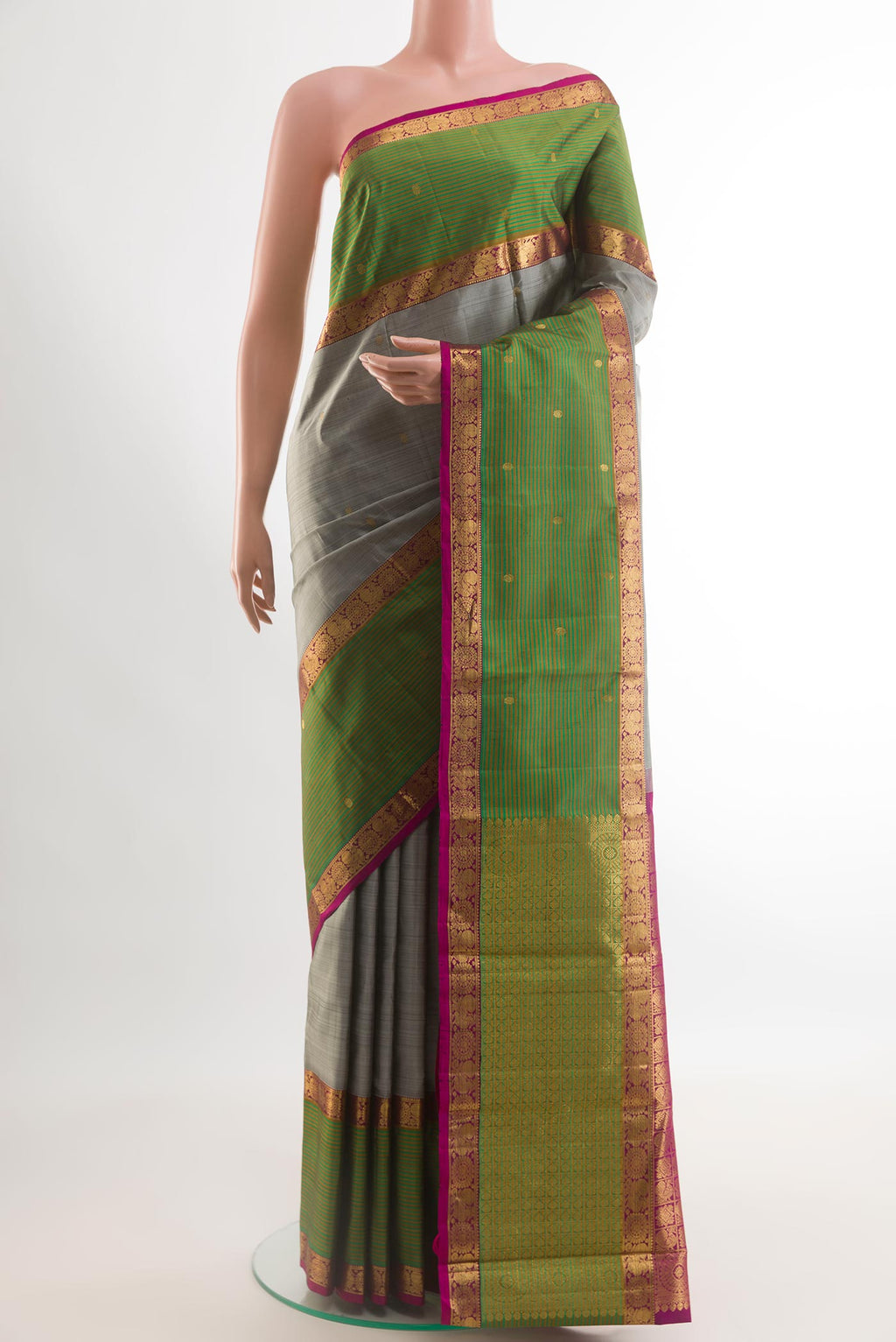 Grey Kanjivaram Silk Saree with Zari Butta on the body and Zari Border.  displayed on a mannequin