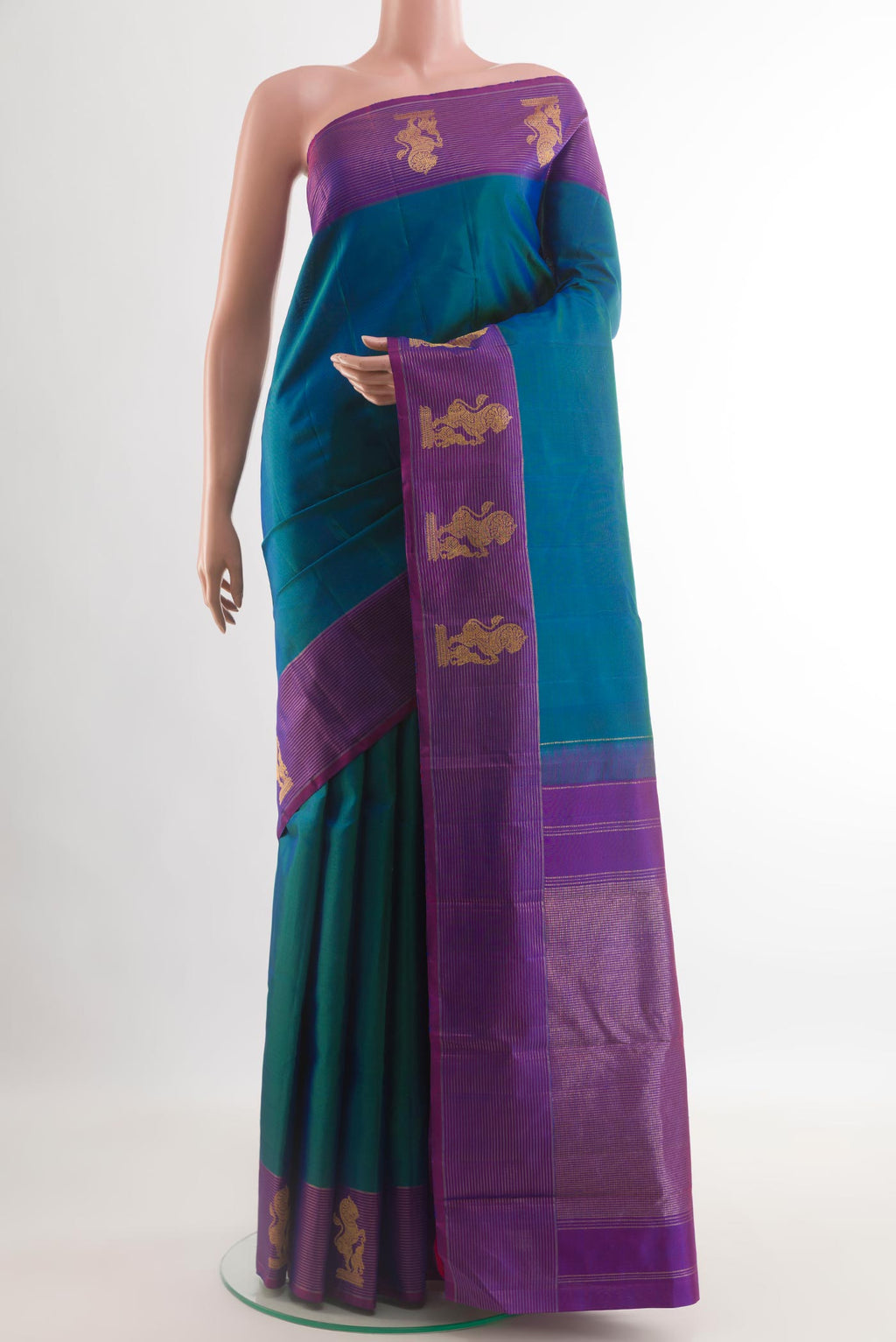 Blue Kanchipuram Silk Saree with Plain Body and Zari Border.  displayed on a mannequin