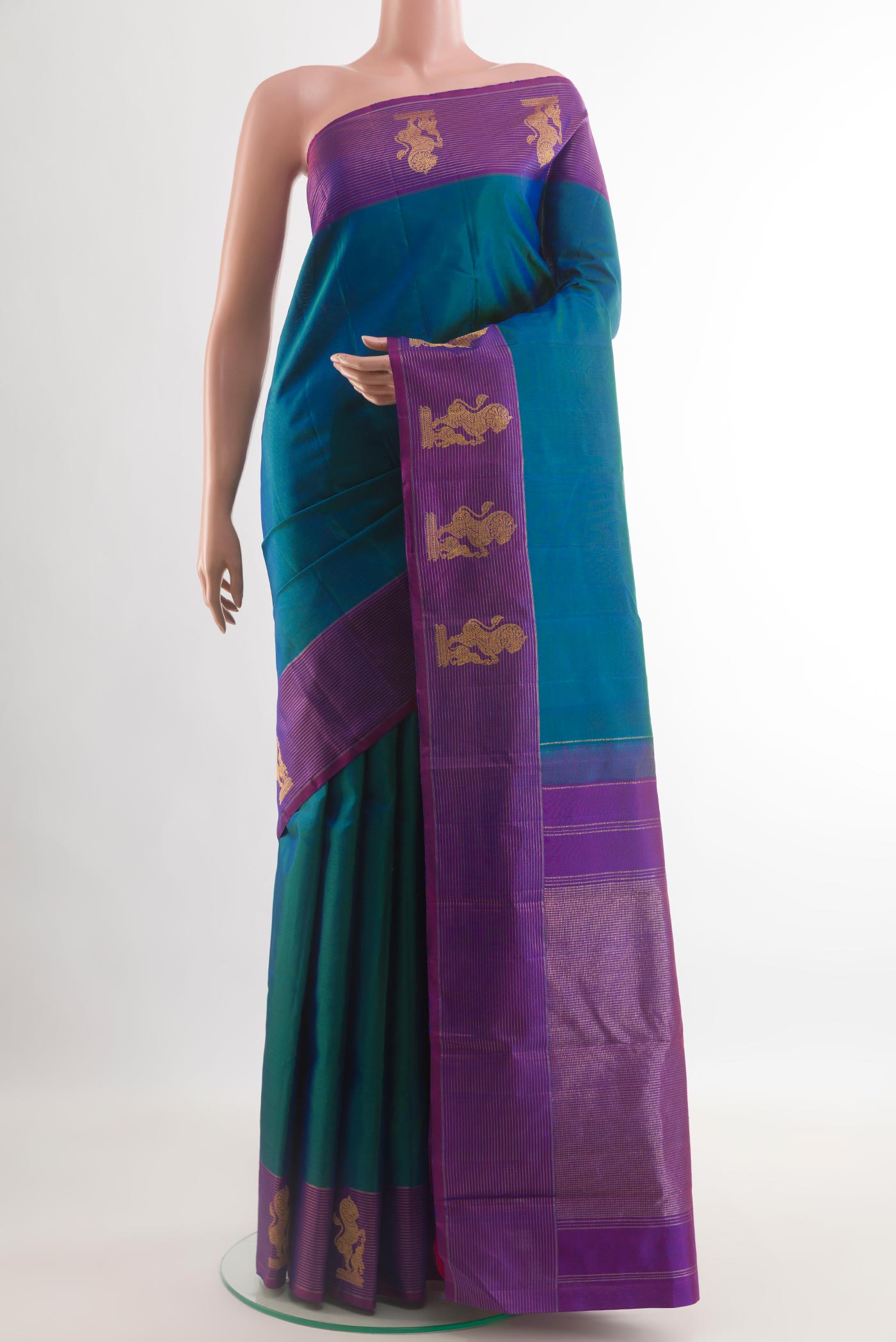Blue Kanchipuram Silk Saree with Plain Body and Zari Border.  displayed on a mannequin