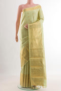 Light Green Kanjivaram Silk Saree with Jacquard With Zari Butta on the body and Zari Border.  displayed on a mannequin