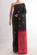 Black Kanchipuram Silk Saree with Zari Butta on the body and Without Border.  displayed on a mannequin