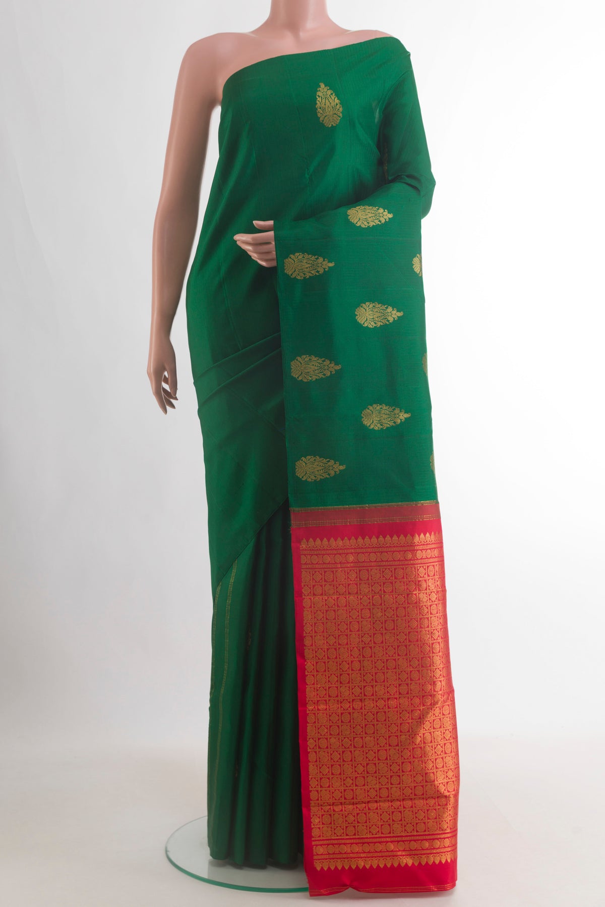Pure Silk Green Kanchipuram Saree with Zari Butta on the body and Without Border.  displayed on a mannequin