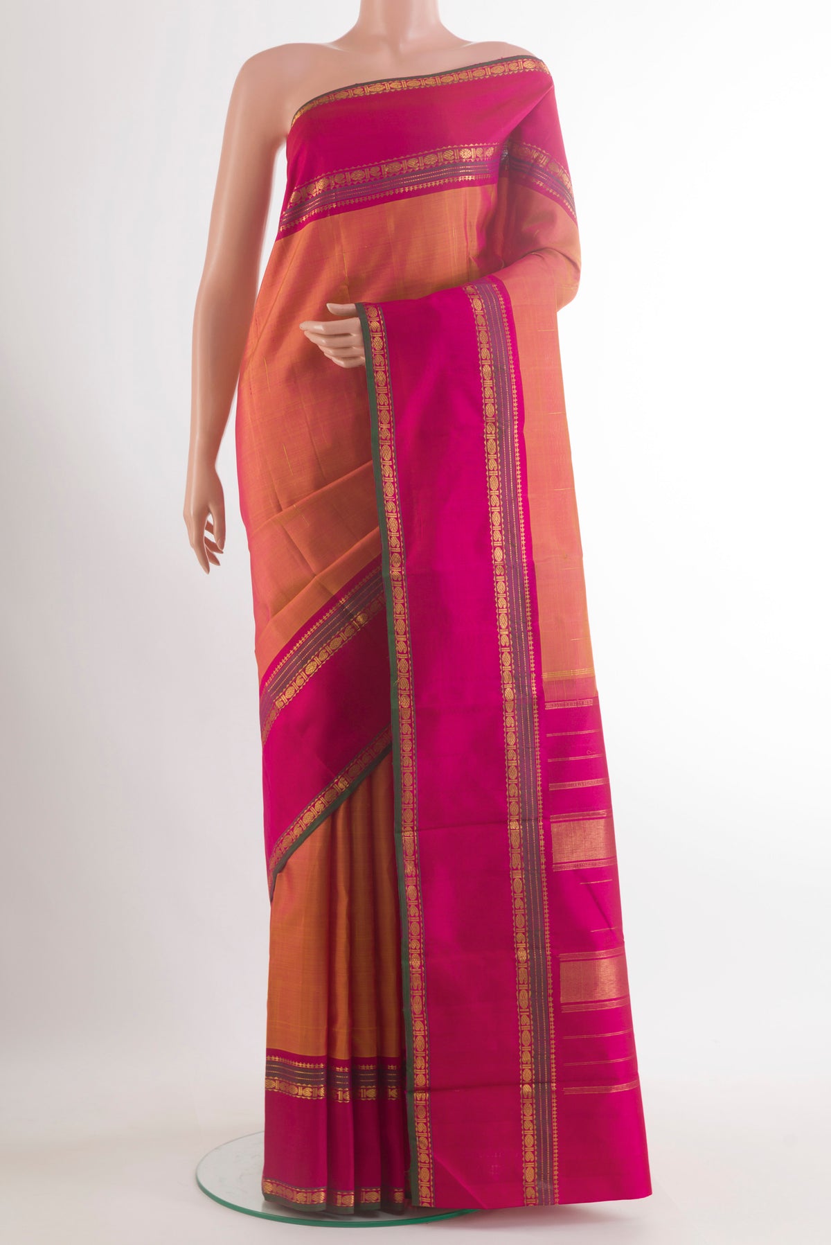Pure Silk Mustard Kanchipuram Saree with Zari Butta on the body and Zari Border.  displayed on a mannequin