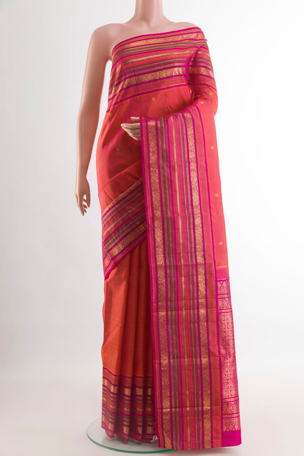 Coral Dual Tone Kanjivaram Silk Saree with Zari Butta on the body and Zari Border.  displayed on a mannequin