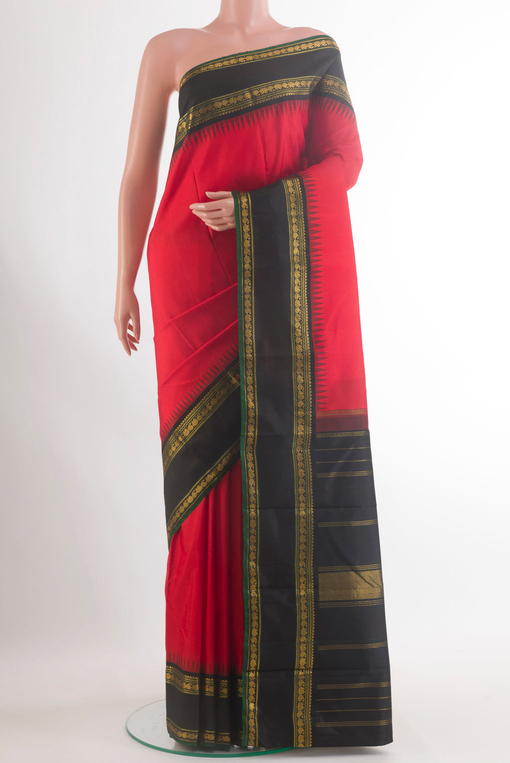 Pure Silk Red Kanjivaram Saree with Plain Body and Zari Border.  displayed on a mannequin