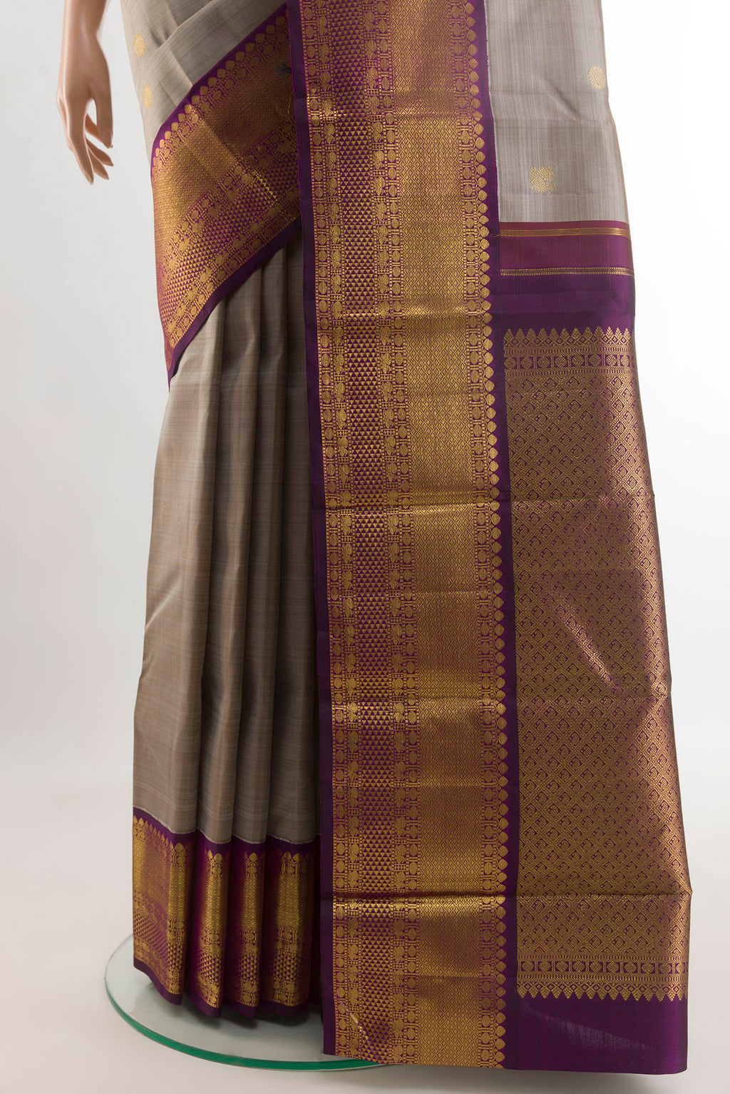Pleats and pallu of Grey Kanjivaram Silk Saree with Zari Butta on the body and Zari Border. 