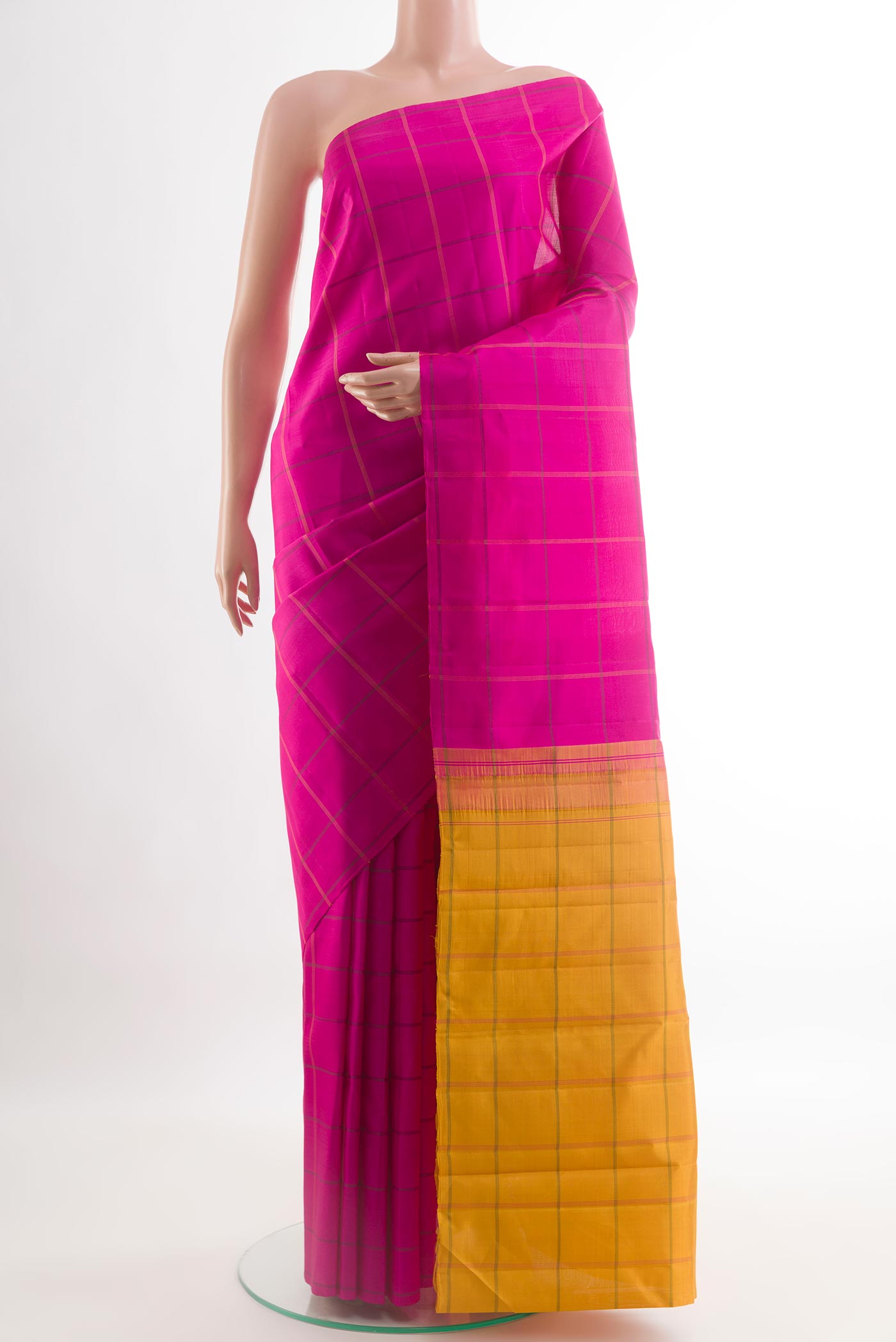 Rani Pink Kanjivaram Silk Saree with Checked design on the body and Without Border.  displayed on a mannequin