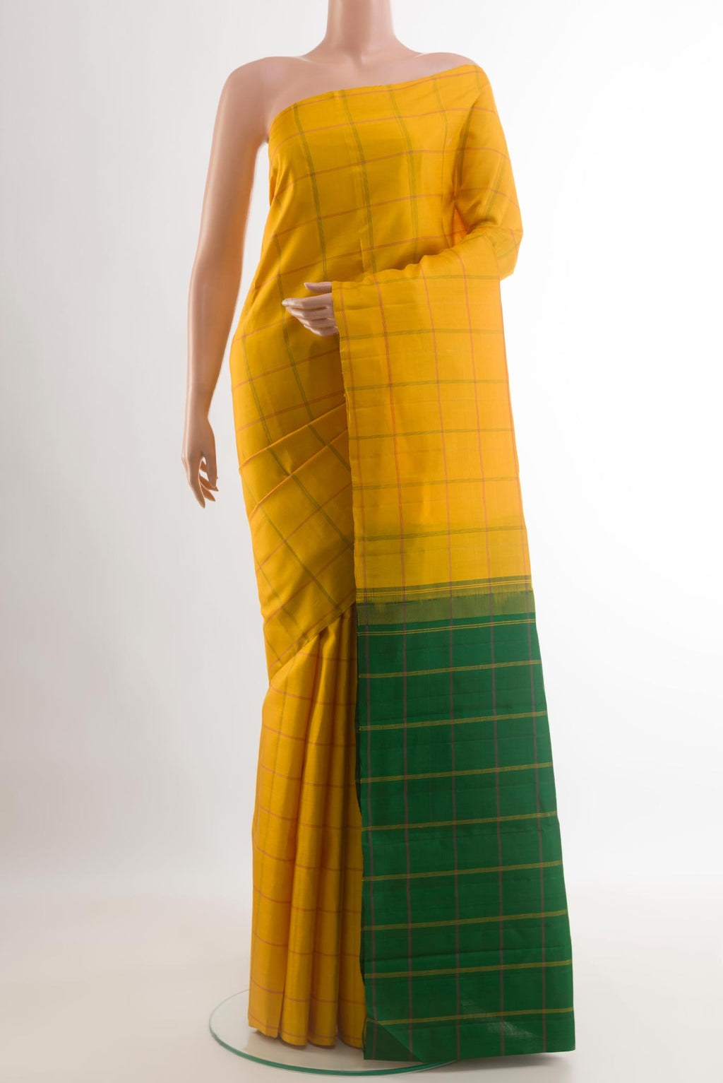 Yellow Kanjivaram Silk Saree with Checked design on the body and Without Border.  displayed on a mannequin