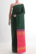Bottle Green Kanchipuram Silk Saree with Zari Butta on the body and Without Border.  displayed on a mannequin