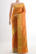 Mustard Kanchipuram Silk Saree with Plain Body and Zari Border.  displayed on a mannequin